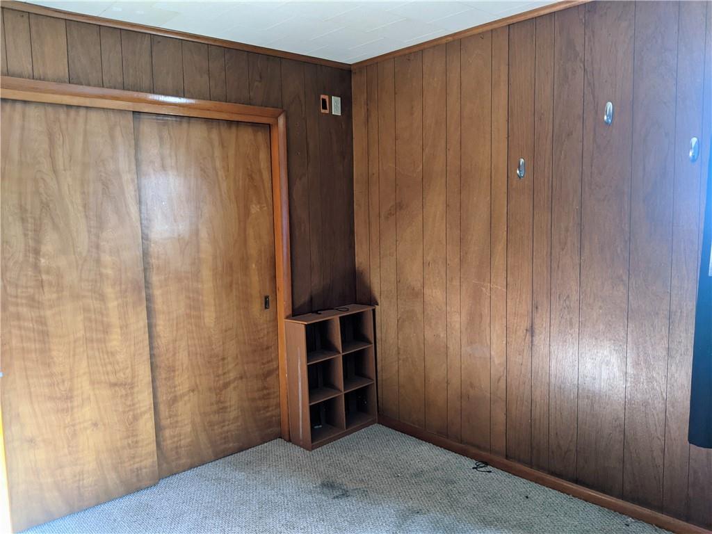 124 Chartiers Road Jefferson, PA 15344 - Photo 10 of 22 a view of an empty room with wooden walls