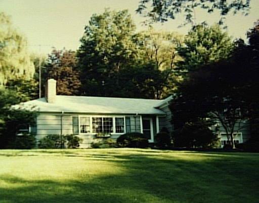 32 Fields Rock Road Fairfield, CT 06890 - Photo 1 of 1 a front view of a house with a garden