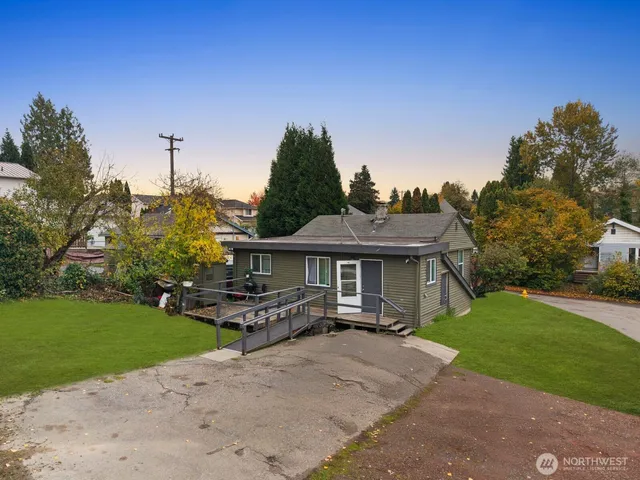 a view of a house with a yard porch and sitting area