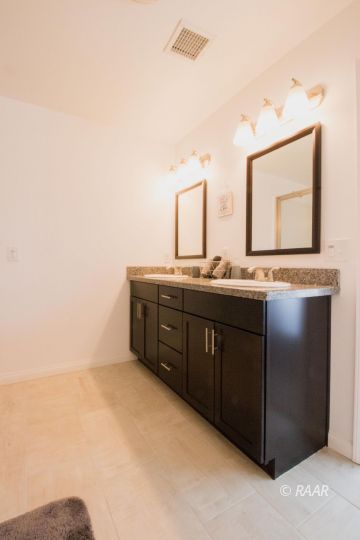 1113 Mayo Street Ridgecrest, CA 93555 - Photo 26 of 31 a kitchen with a sink and a mirror