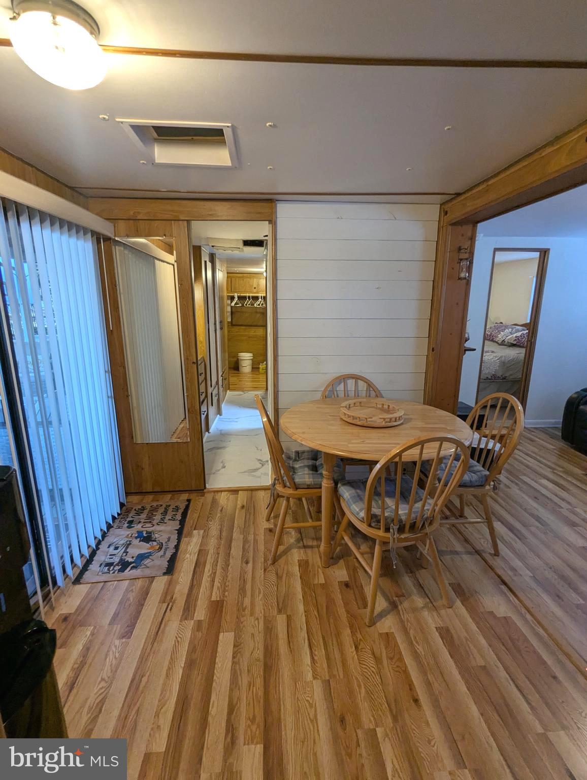 10 Old Faceful Road Falling Waters, WV 25419 - Photo 15 of 19 a view of a dining room with furniture and wooden floor