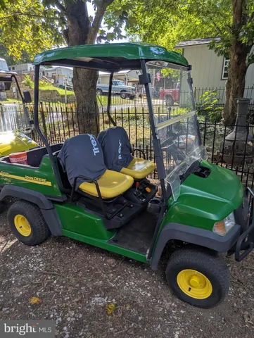 a view of a backyard with a table and chairs