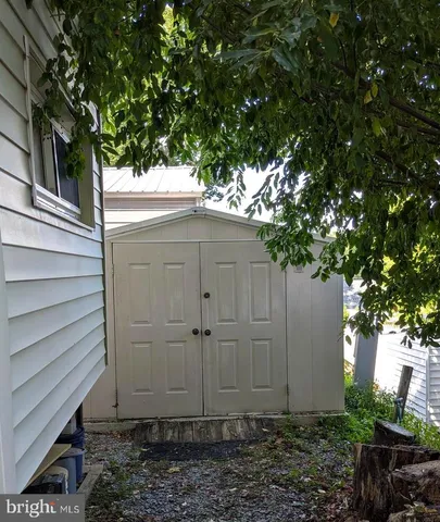 a view of a house with a small yard