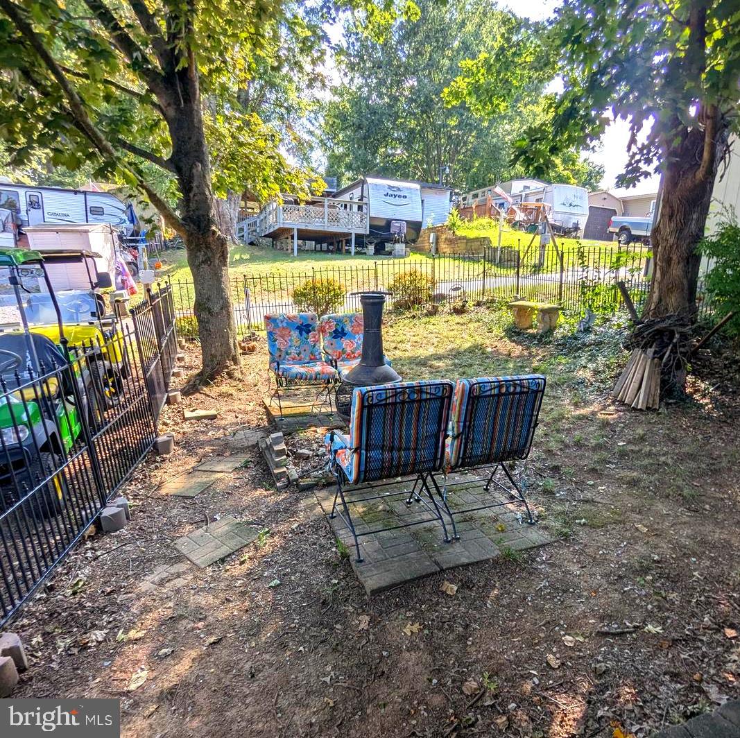 10 Old Faceful Road Falling Waters, WV 25419 - Photo 4 of 19 a view of a sitting area with furniture and wooden fence