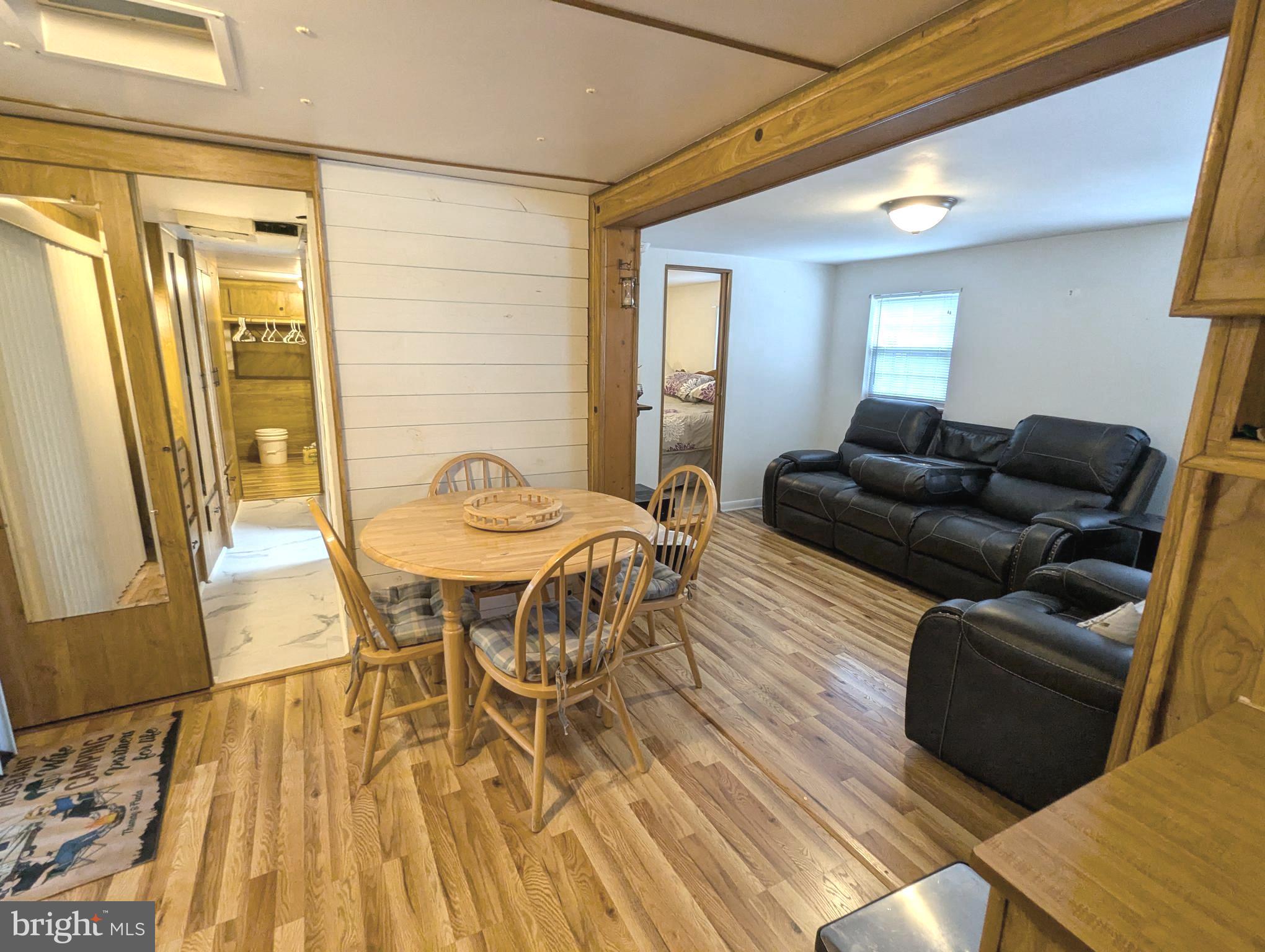 10 Old Faceful Road Falling Waters, WV 25419 - Photo 10 of 19 a living room with furniture and a wooden floor