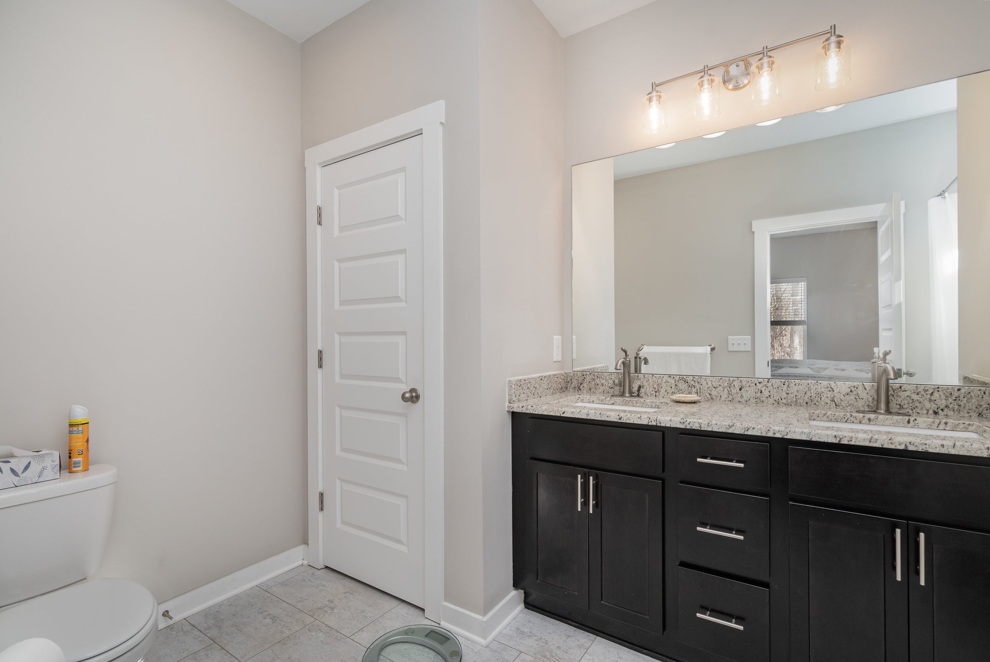 2074 Morgan Court Springfield, TN 37172 - Photo 16 of 24 a bathroom with a granite countertop sink and a mirror