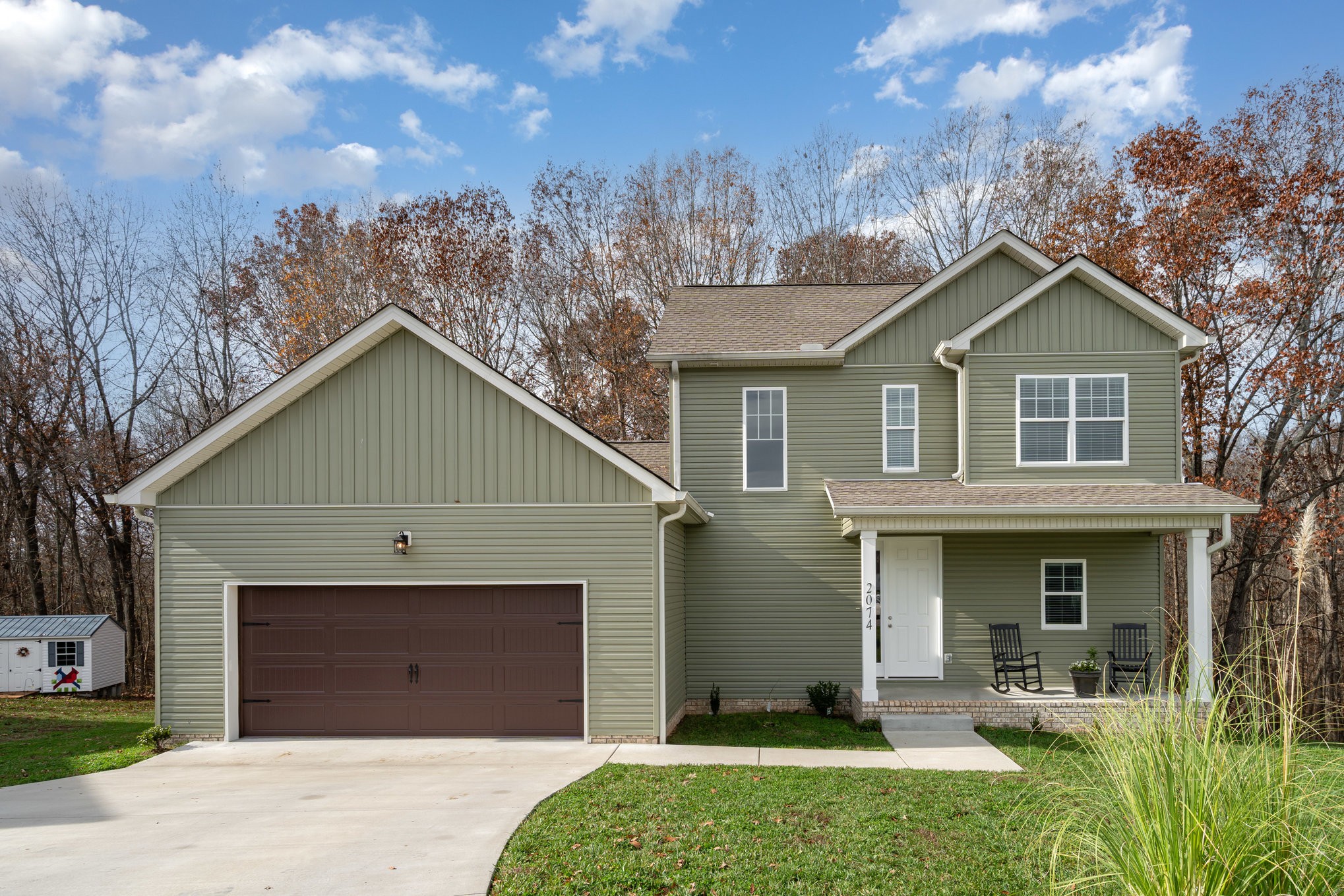 2074 Morgan Court Springfield, TN 37172 - Photo 2 of 24 a front view of a house with a yard and garage