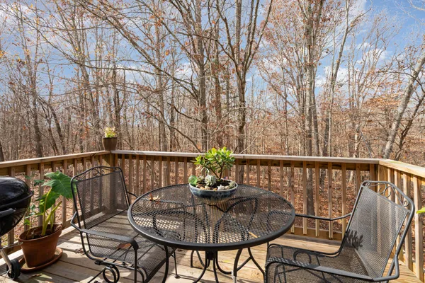 a view of a balcony with furniture