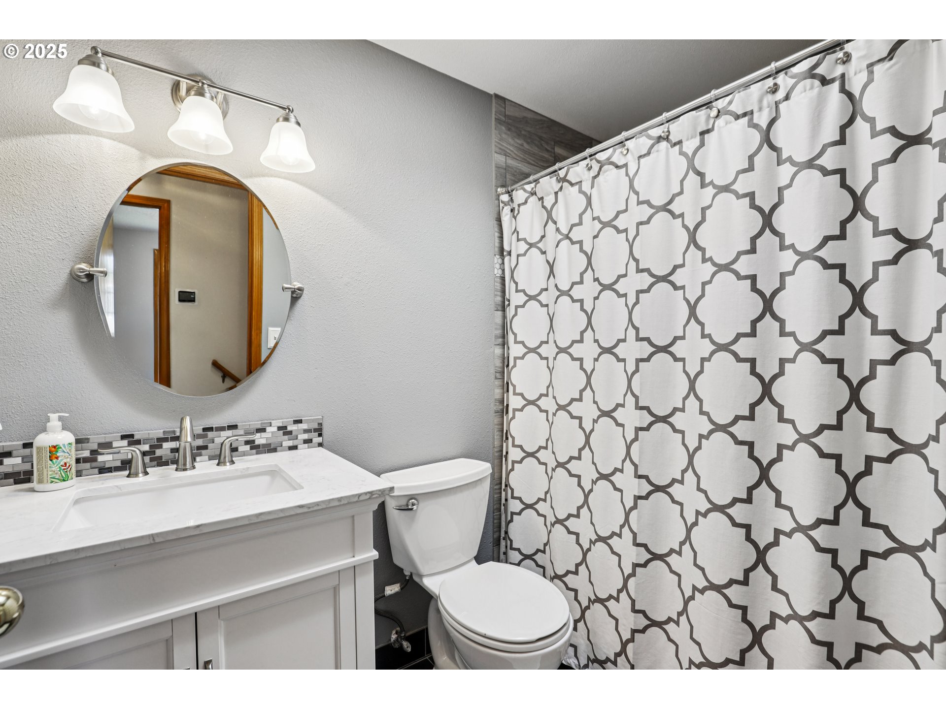 3786 Southwest 8th Street Gresham, OR 97030 - Photo 20 of 43 a bathroom with a sink and a mirror