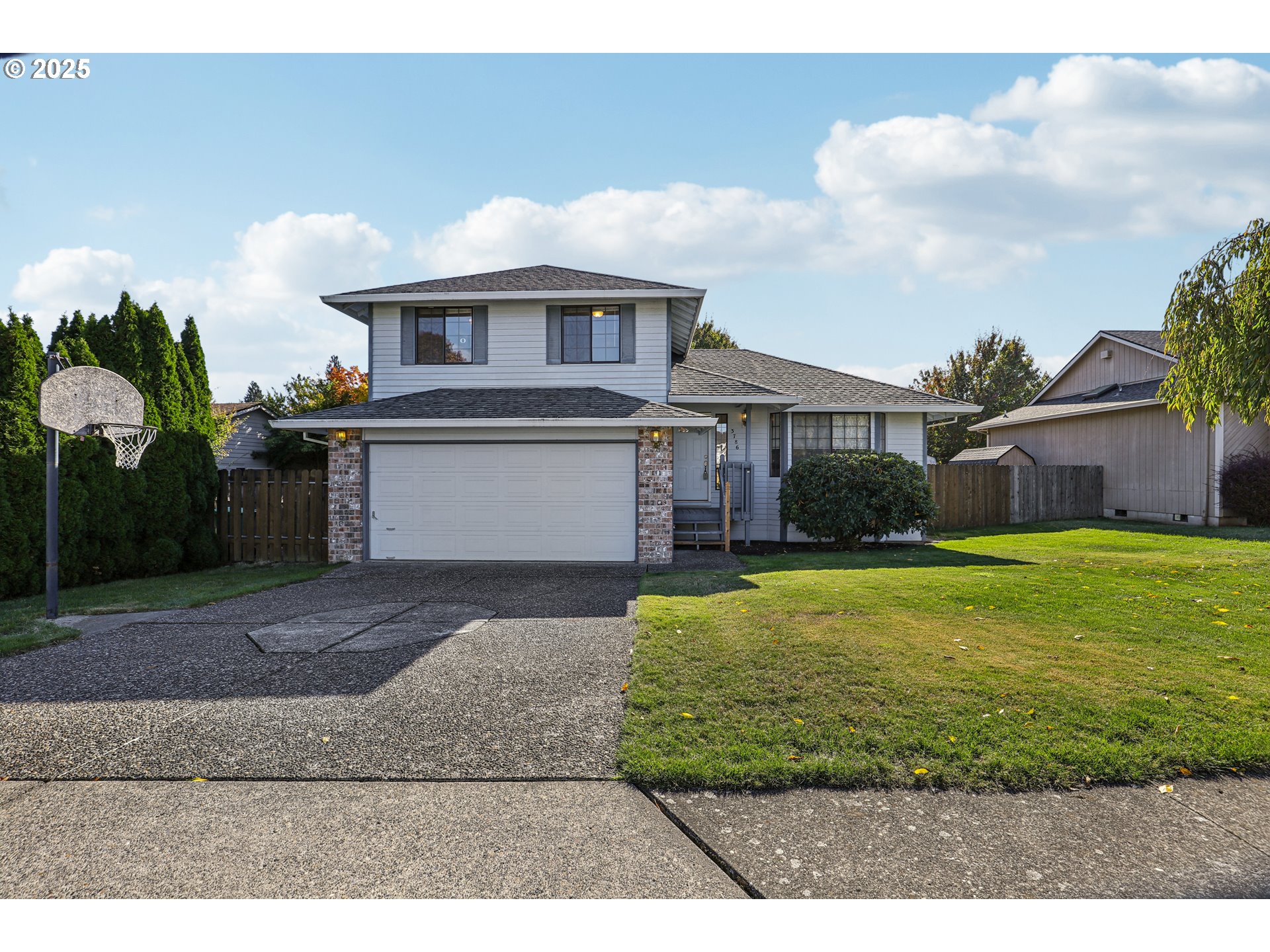 3786 Southwest 8th Street Gresham, OR 97030 - Photo 2 of 43 a front view of a house with garden