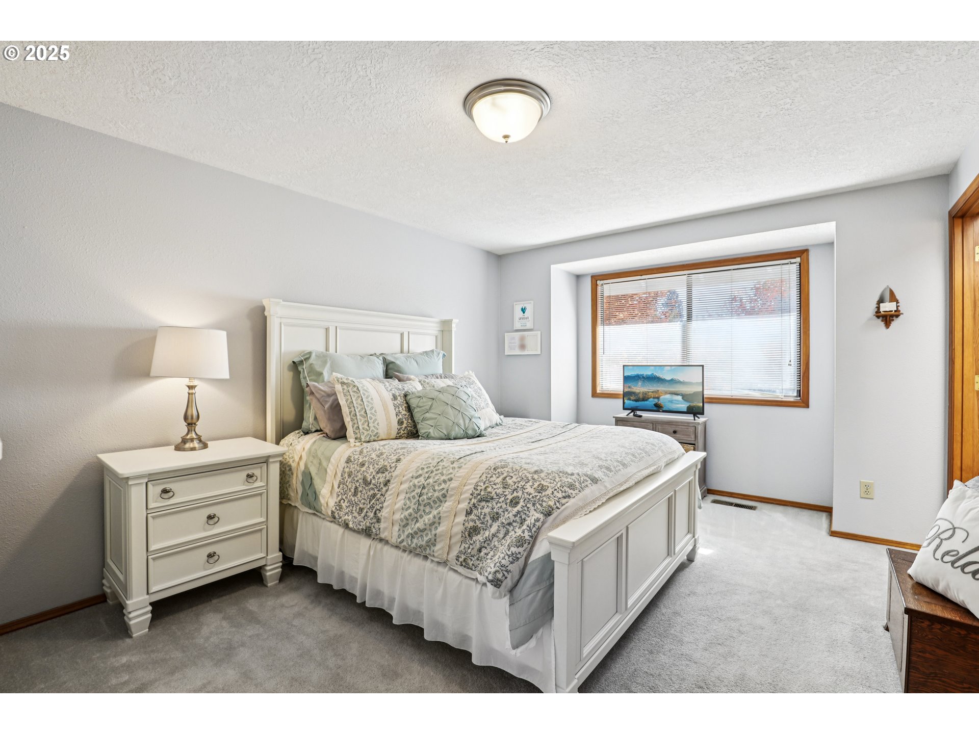 3786 Southwest 8th Street Gresham, OR 97030 - Photo 26 of 43 a spacious bedroom with a bed and window