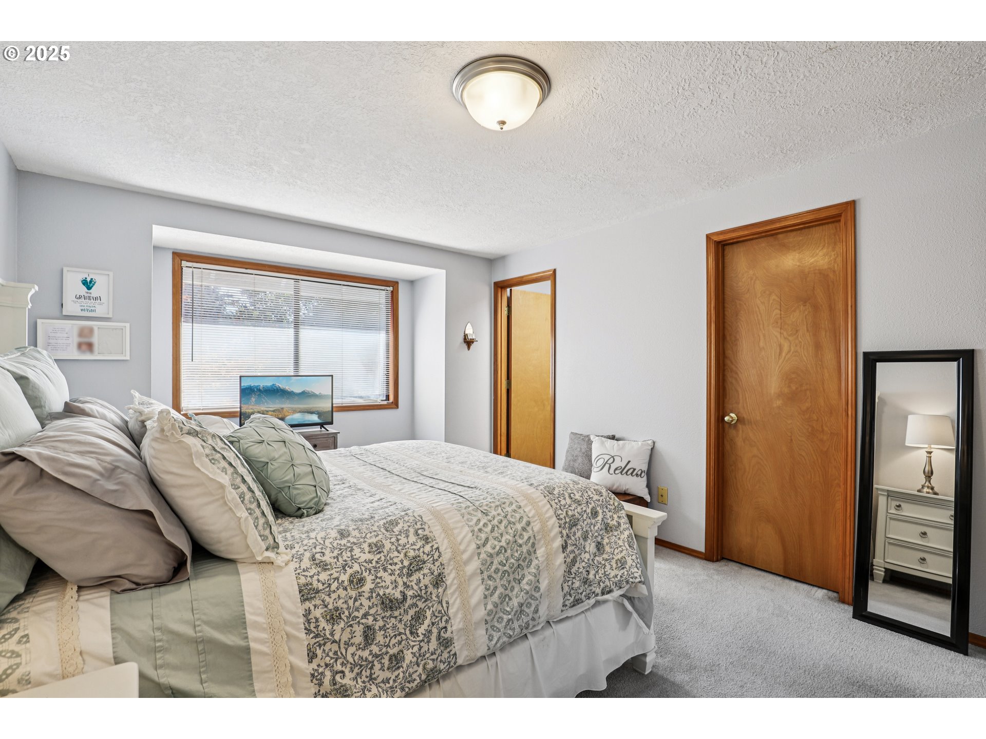 3786 Southwest 8th Street Gresham, OR 97030 - Photo 27 of 43 a bedroom with a bed and a large mirror