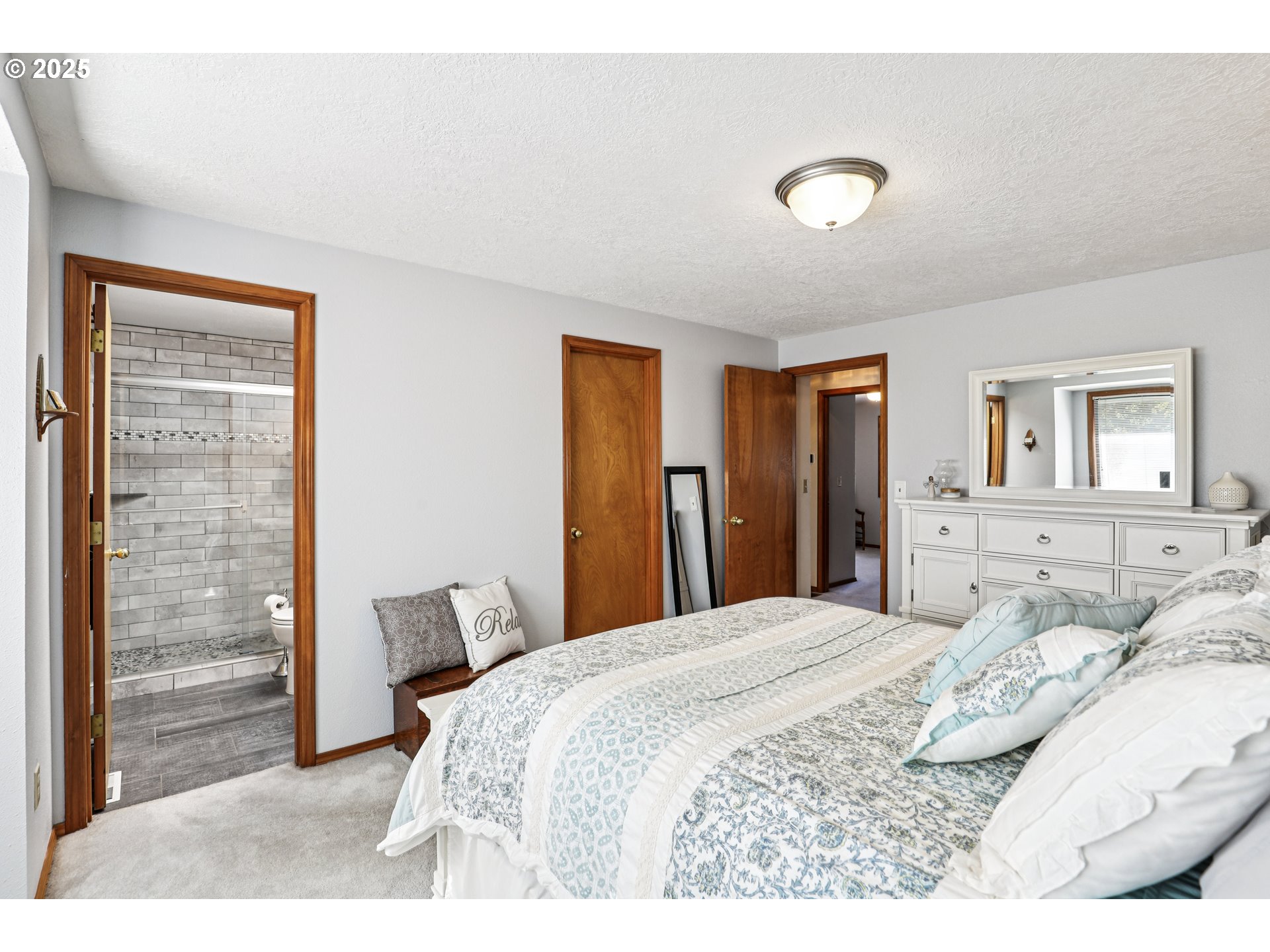 3786 Southwest 8th Street Gresham, OR 97030 - Photo 28 of 43 a bedroom with a bed and a lamp