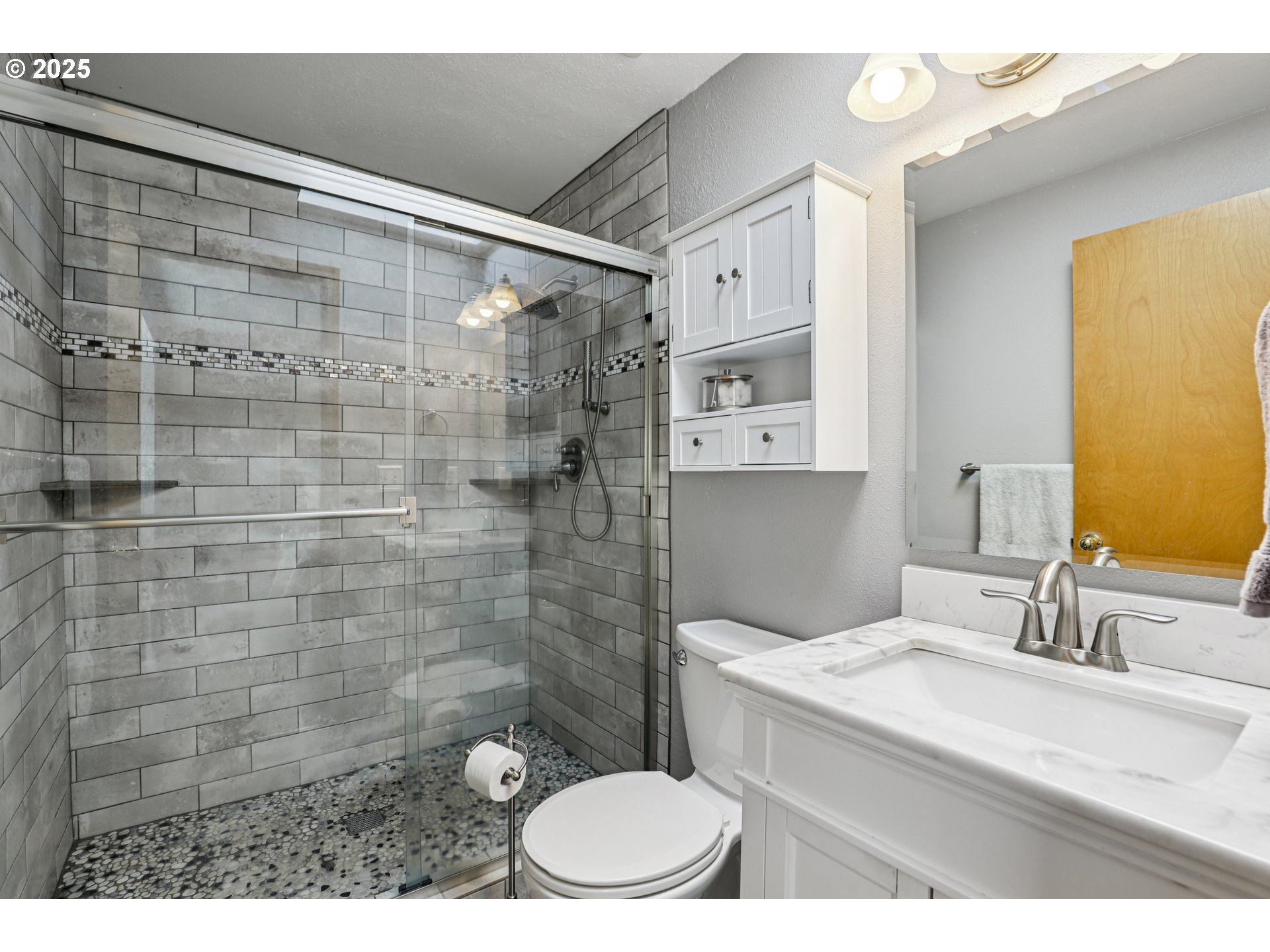 3786 Southwest 8th Street Gresham, OR 97030 - Photo 29 of 43 a bathroom with a sink a toilet and shower