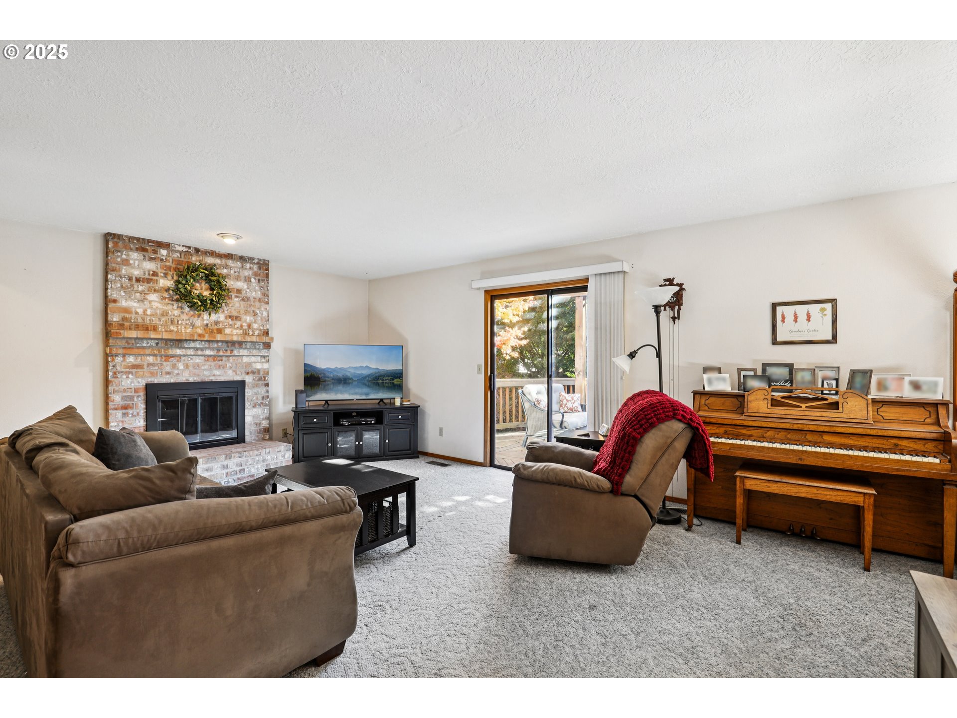 3786 Southwest 8th Street Gresham, OR 97030 - Photo 3 of 43 a living room with furniture and a fireplace