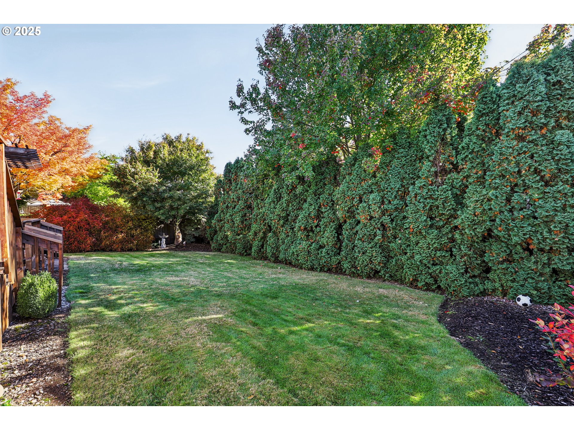 3786 Southwest 8th Street Gresham, OR 97030 - Photo 42 of 43 a grassy field with trees in the background