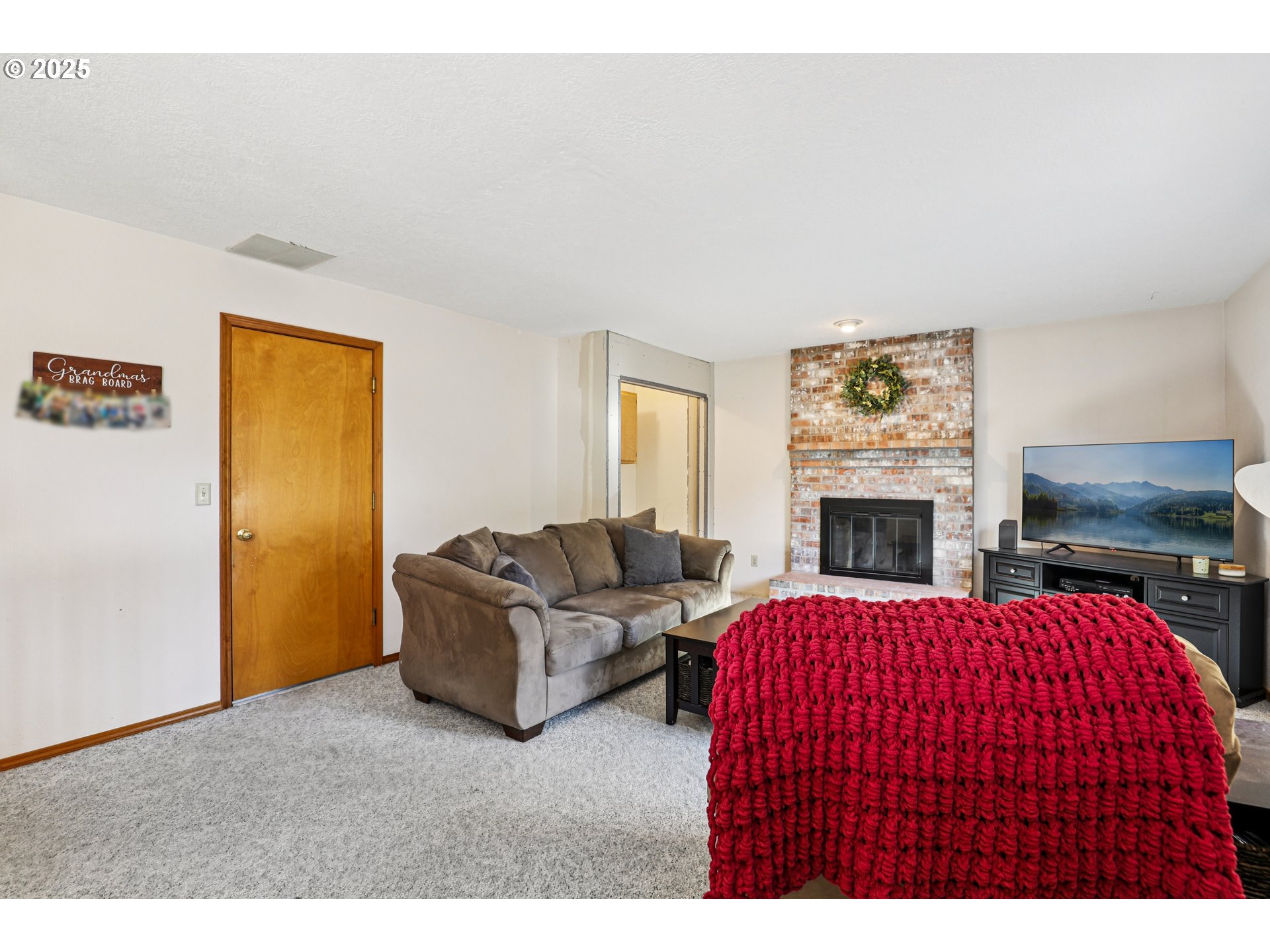 3786 Southwest 8th Street Gresham, OR 97030 - Photo 5 of 43 a living room with furniture and a fireplace