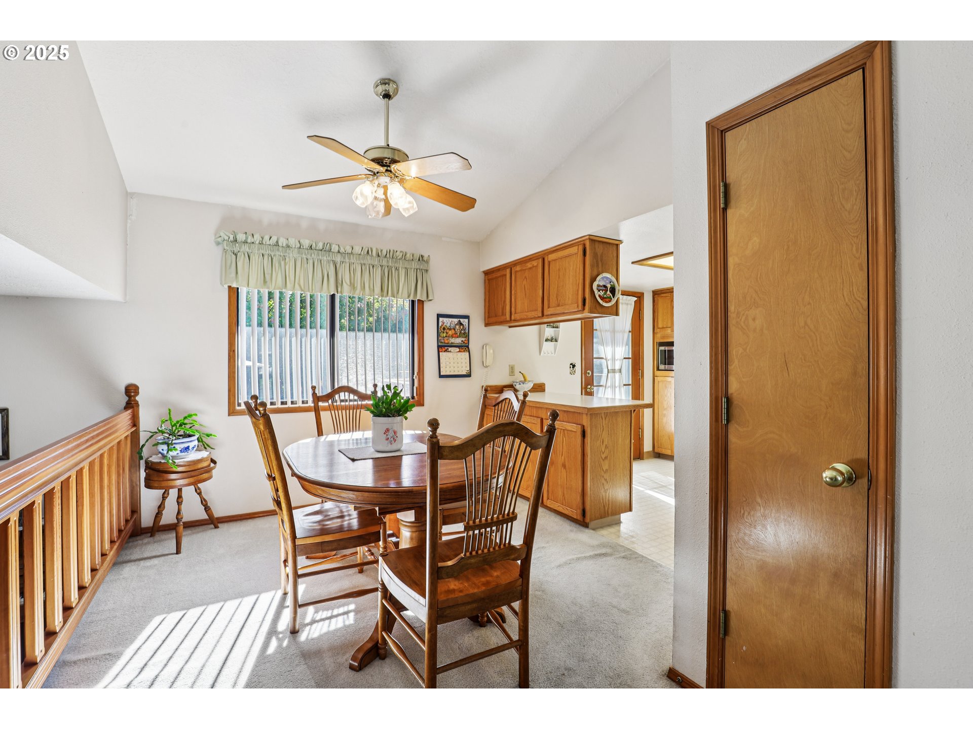 3786 Southwest 8th Street Gresham, OR 97030 - Photo 10 of 43 a dining room with furniture a chandelier and a rug