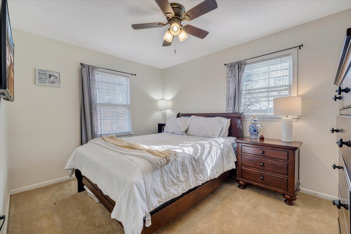 609 Lakeshore Terrace Road Hardy, VA 24101 - Photo 19 of 44 a bedroom with a bed and a chandelier