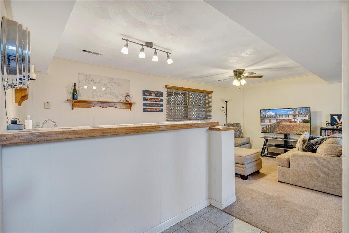 609 Lakeshore Terrace Road Hardy, VA 24101 - Photo 21 of 44 a living room with furniture and a chandelier