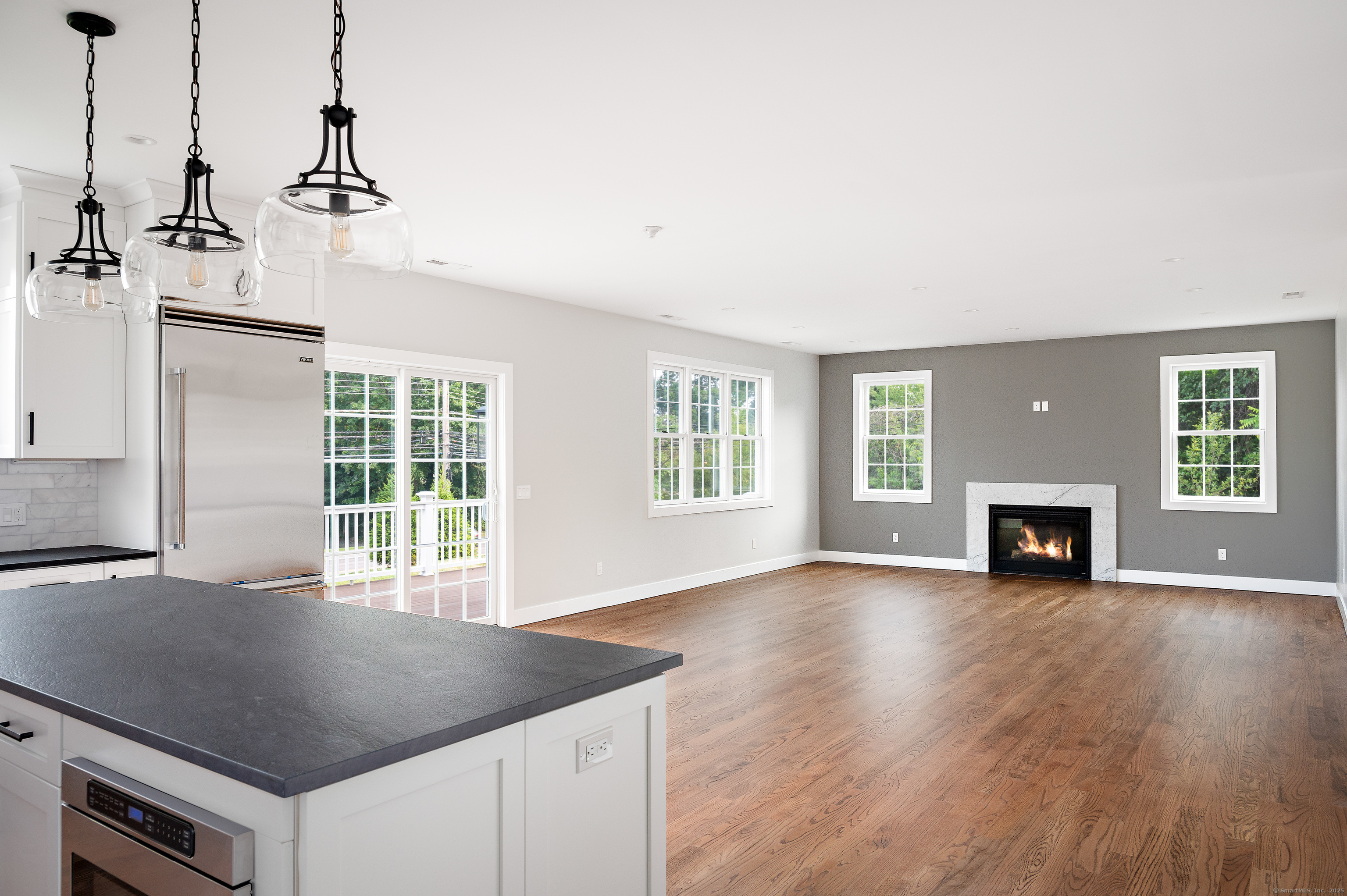 6 Walnut Ridge Court Stamford, CT 06905 - Photo 12 of 35 a view of empty room with wooden floor and fireplace