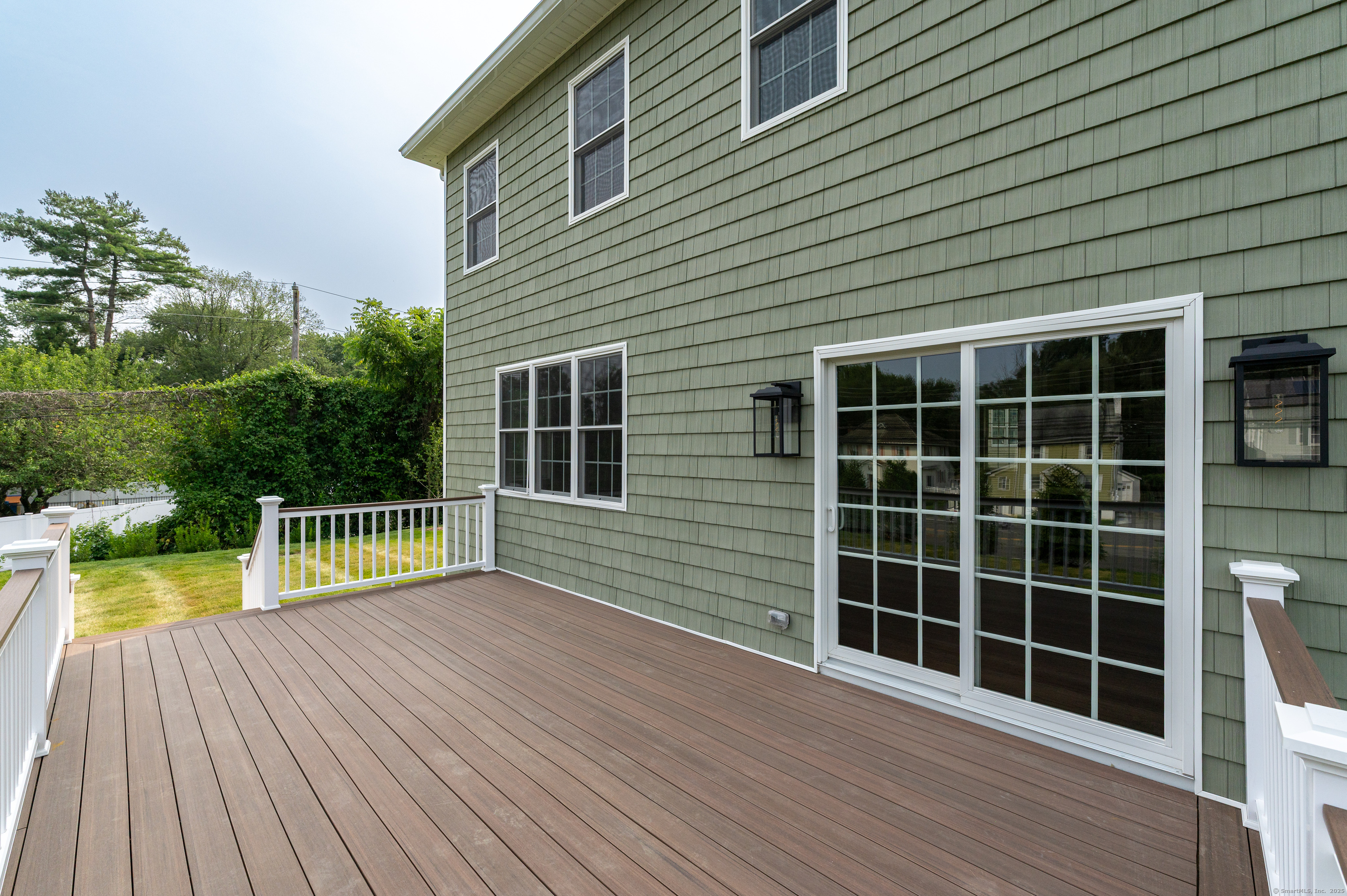 6 Walnut Ridge Court Stamford, CT 06905 - Photo 13 of 35 a view of a house with a wooden deck