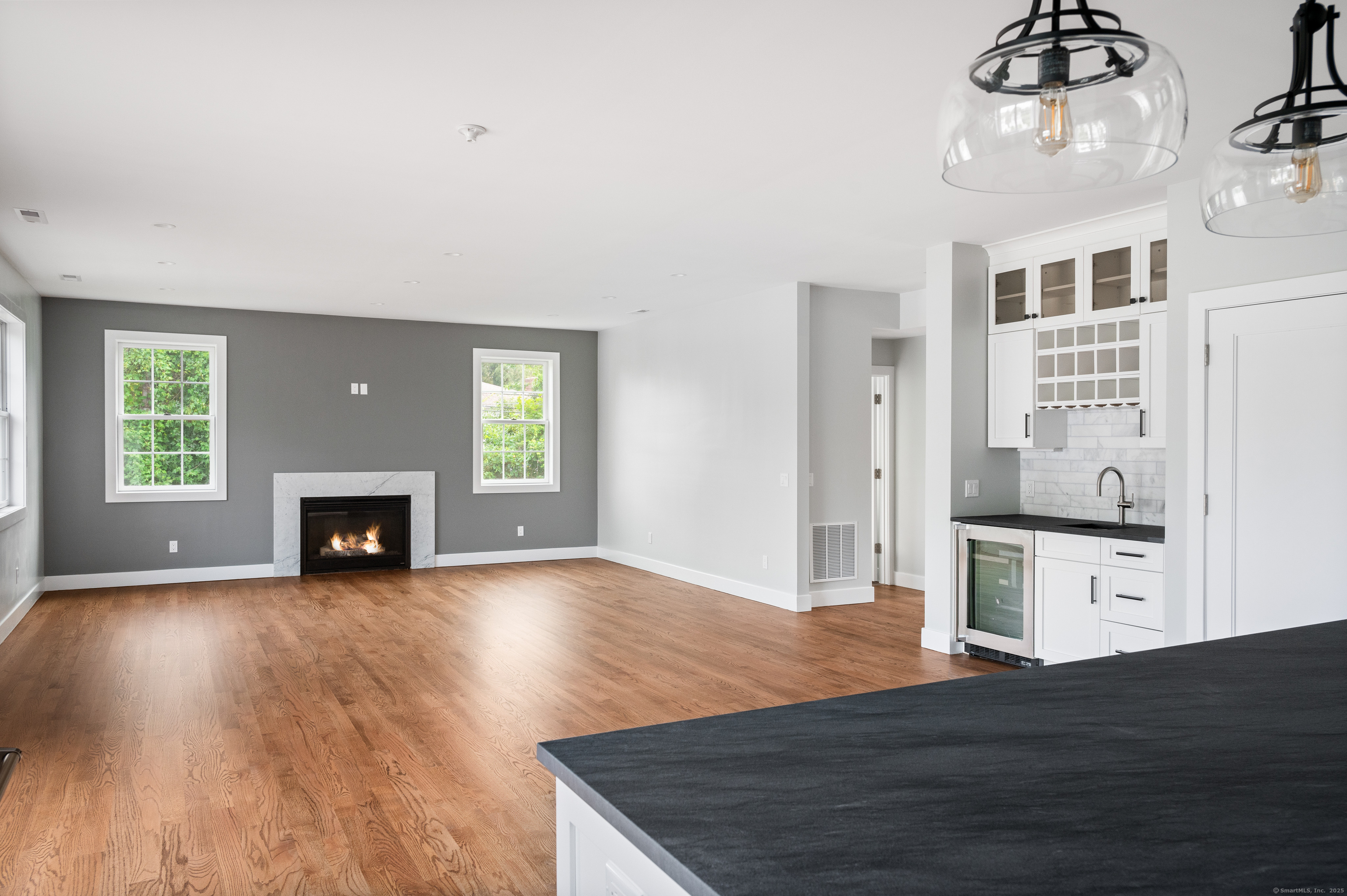 6 Walnut Ridge Court Stamford, CT 06905 - Photo 15 of 35 a view of a room with wooden floor fireplace and windows