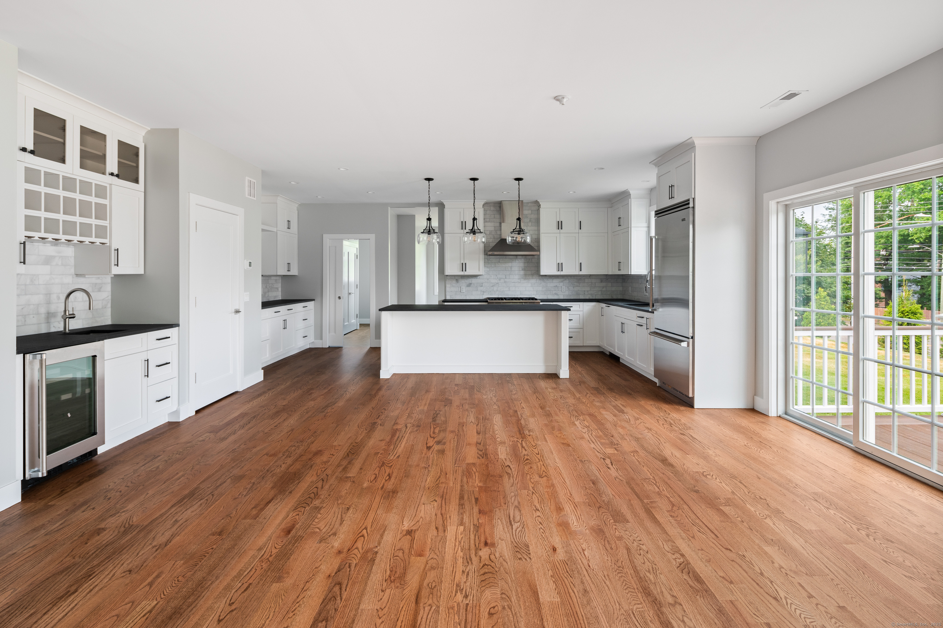 6 Walnut Ridge Court Stamford, CT 06905 - Photo 16 of 35 a large kitchen with cabinets wooden floor and stainless steel appliances