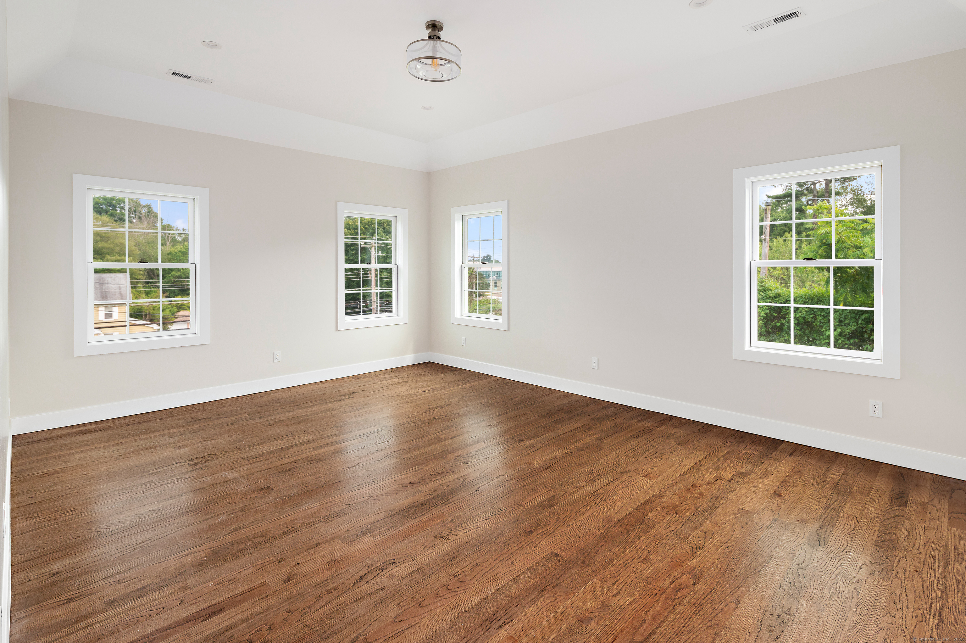 6 Walnut Ridge Court Stamford, CT 06905 - Photo 23 of 35 a view of an empty room with wooden floor and a window