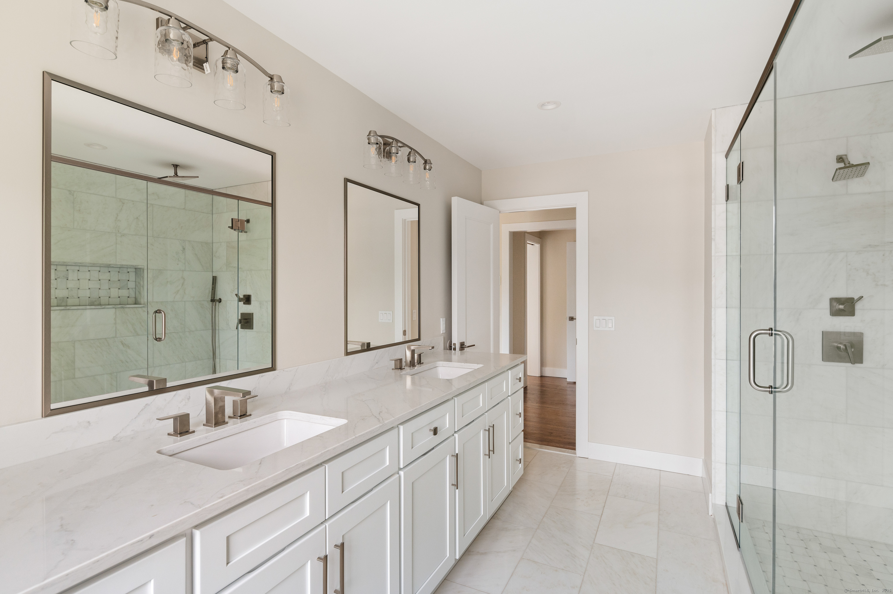 6 Walnut Ridge Court Stamford, CT 06905 - Photo 24 of 35 a bathroom with a double vanity sink mirror double and shower