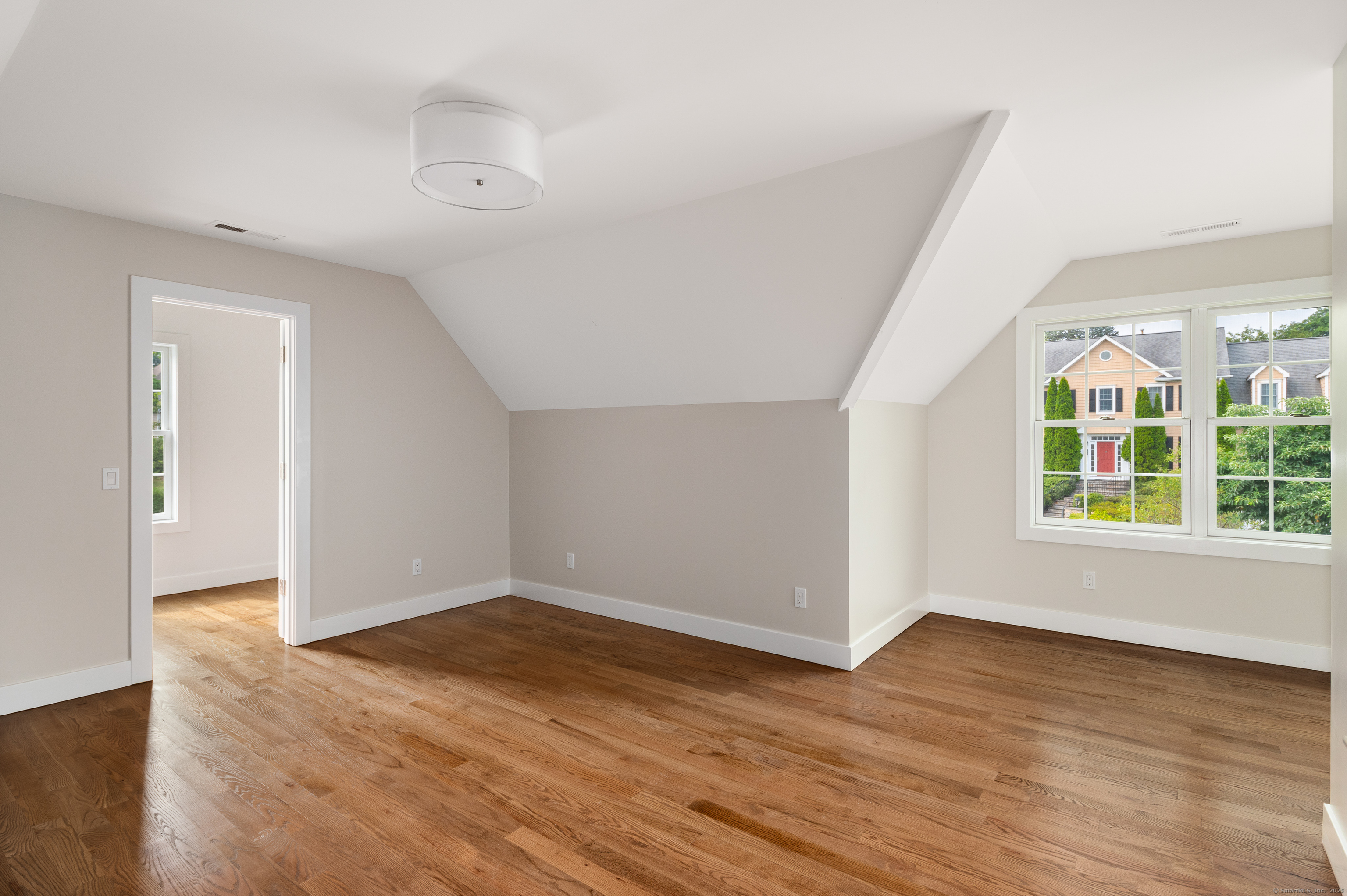 6 Walnut Ridge Court Stamford, CT 06905 - Photo 25 of 35 an empty room with wooden floor and windows