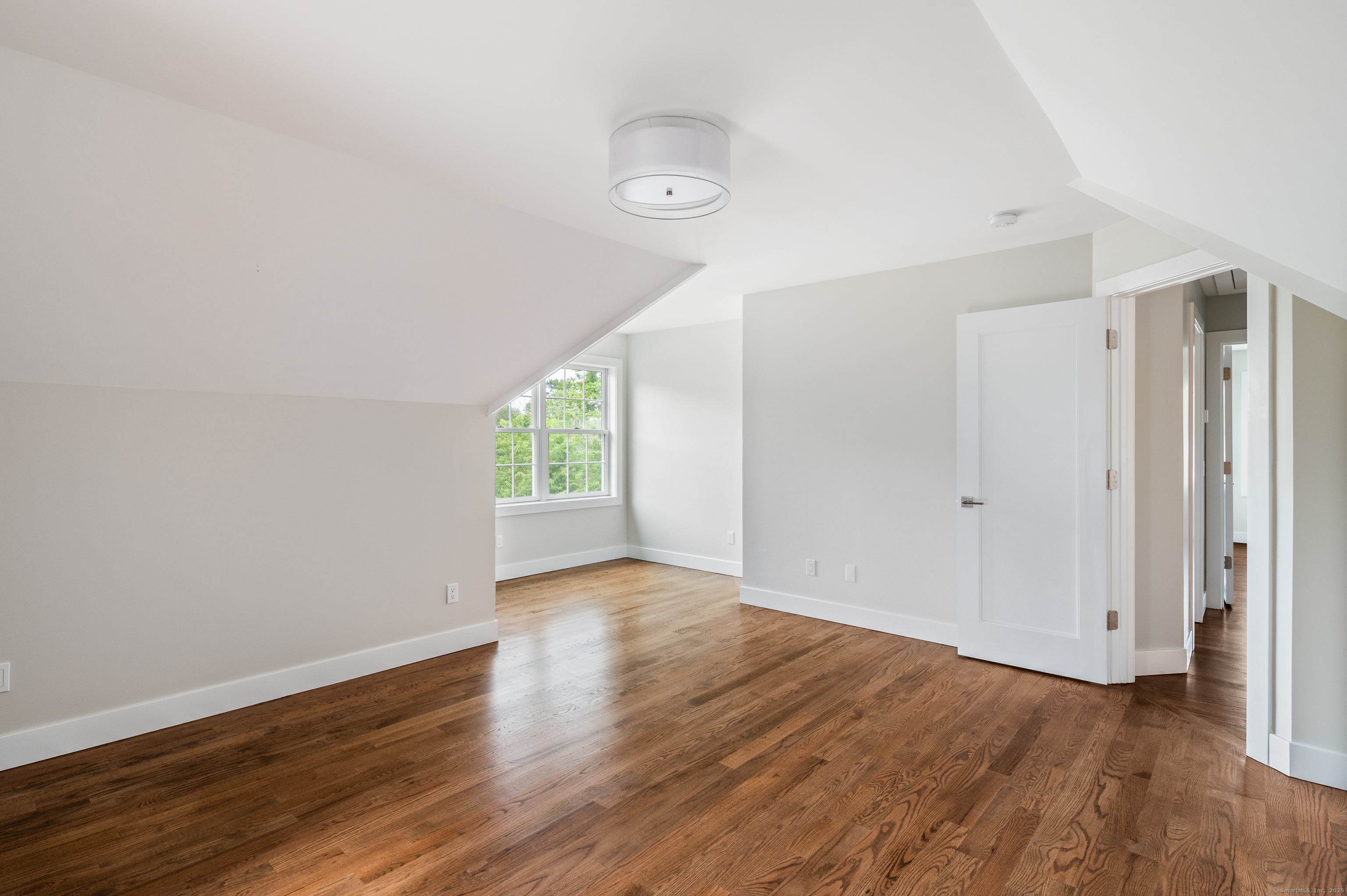 6 Walnut Ridge Court Stamford, CT 06905 - Photo 27 of 35 an empty room with wooden floor and windows