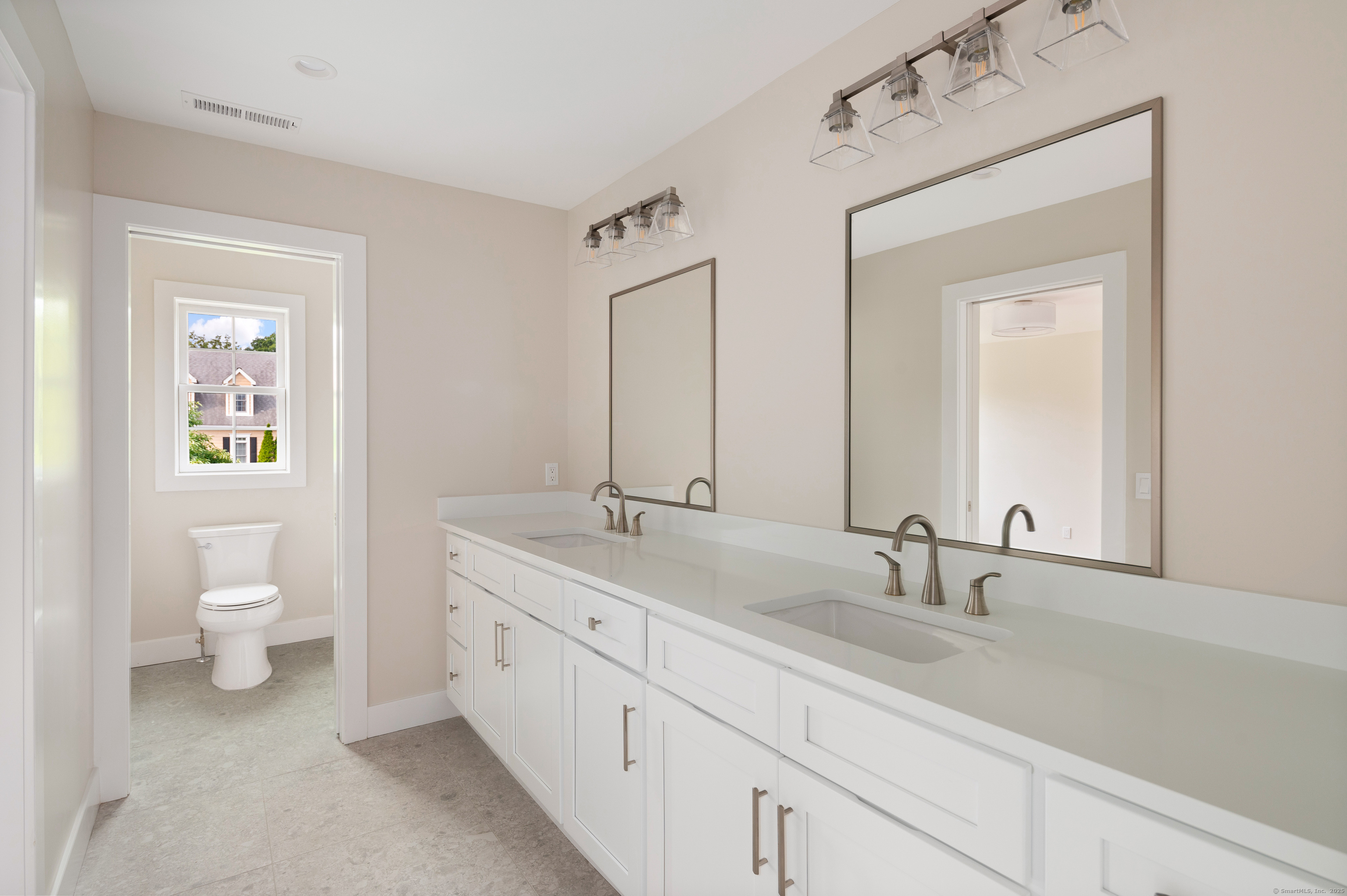 6 Walnut Ridge Court Stamford, CT 06905 - Photo 29 of 35 a bathroom with a toilet sink and mirror