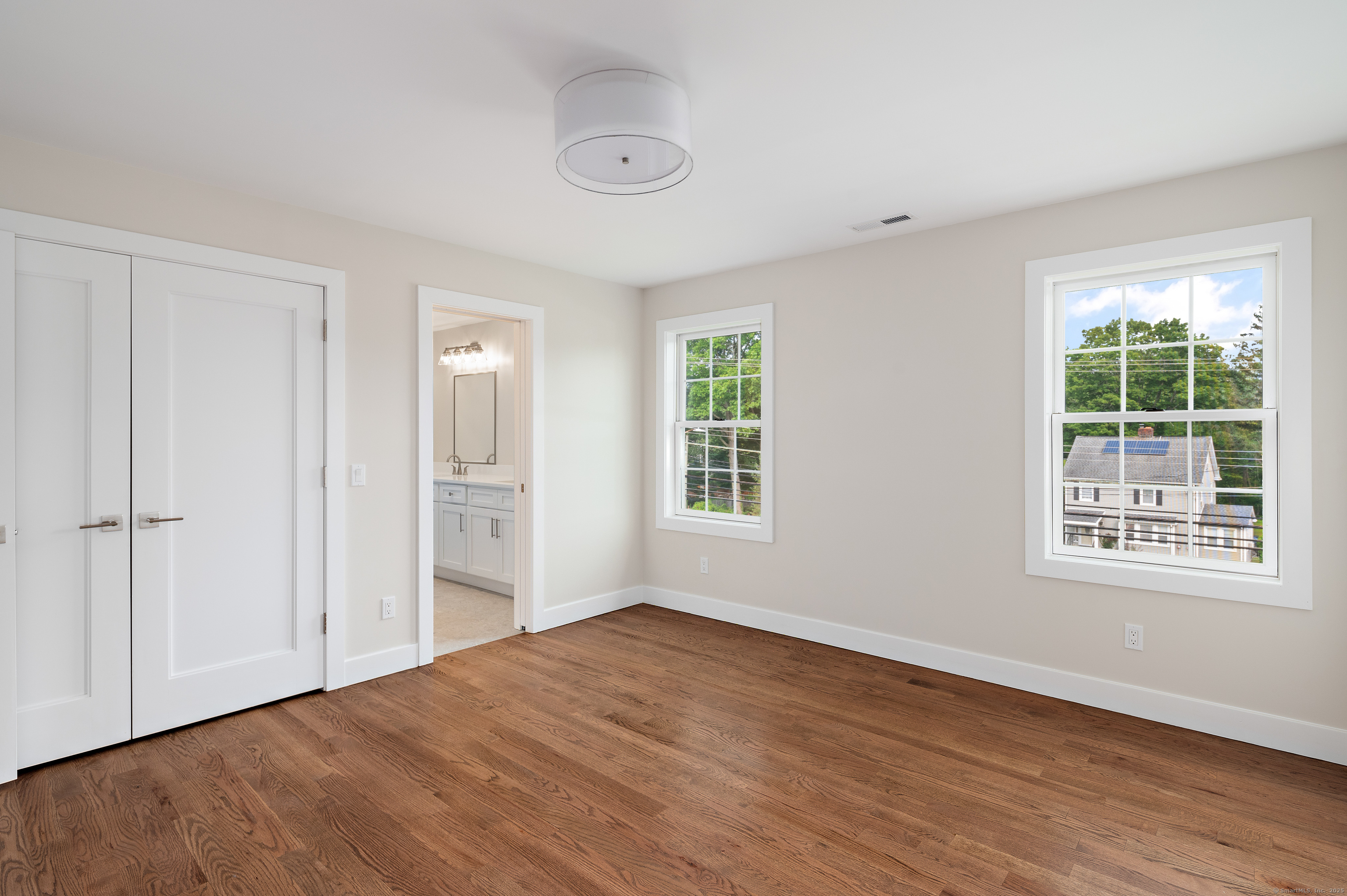 6 Walnut Ridge Court Stamford, CT 06905 - Photo 30 of 35 a view of an empty room with wooden floor and a window