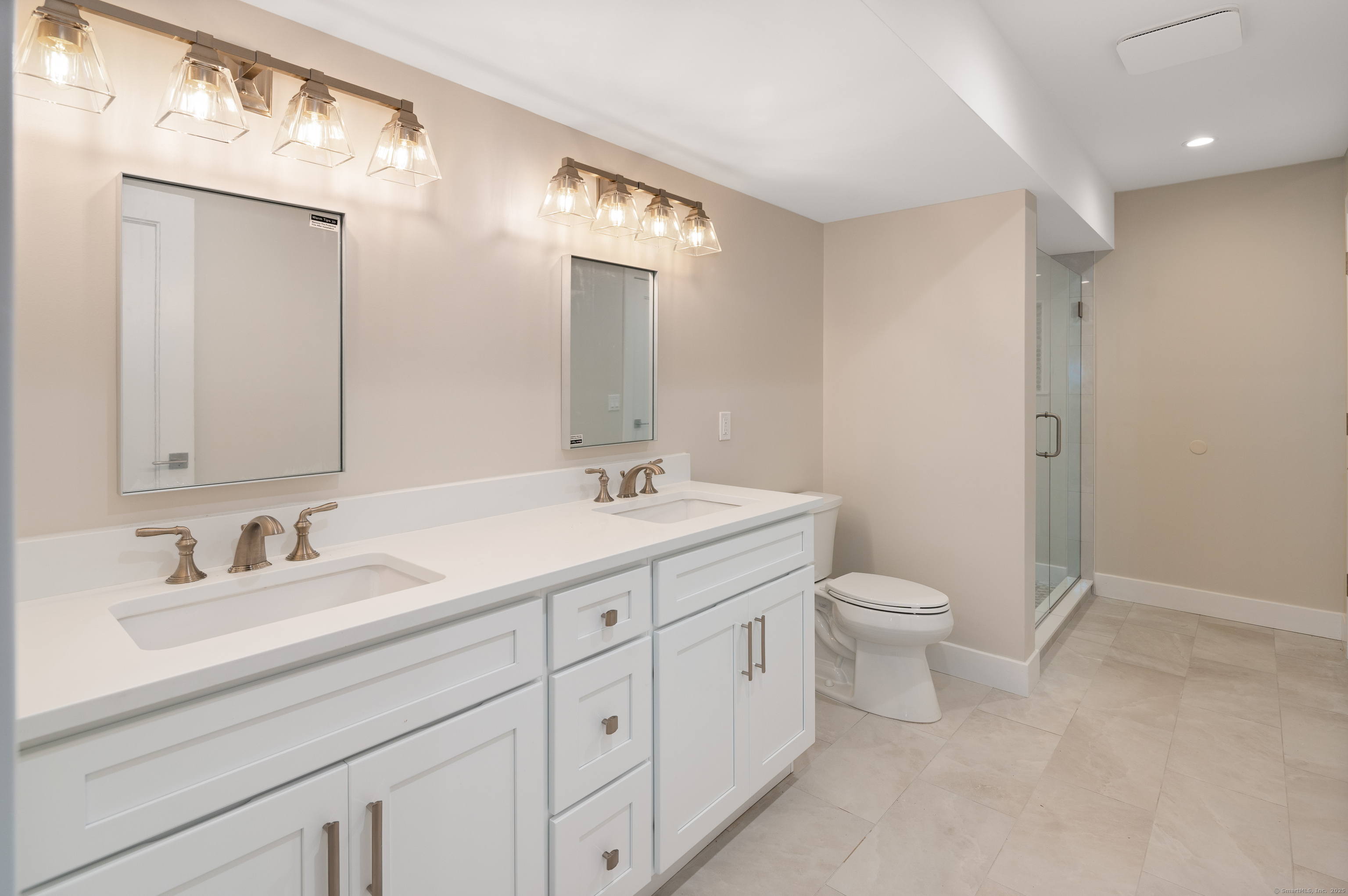 6 Walnut Ridge Court Stamford, CT 06905 - Photo 32 of 35 a bathroom with a toilet a sink and mirror