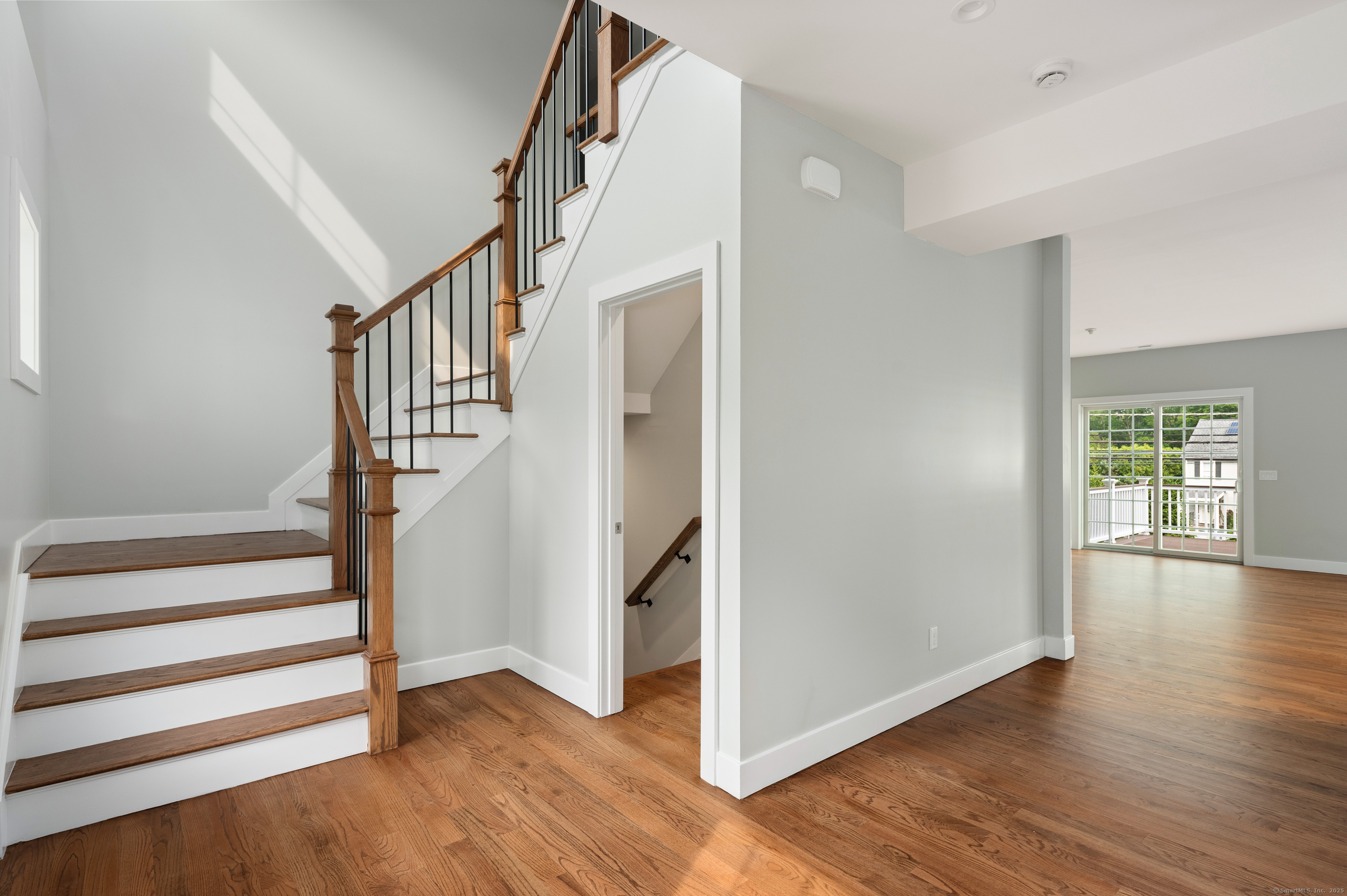 6 Walnut Ridge Court Stamford, CT 06905 - Photo 9 of 35 a view of entryway with wooden floor and stairs