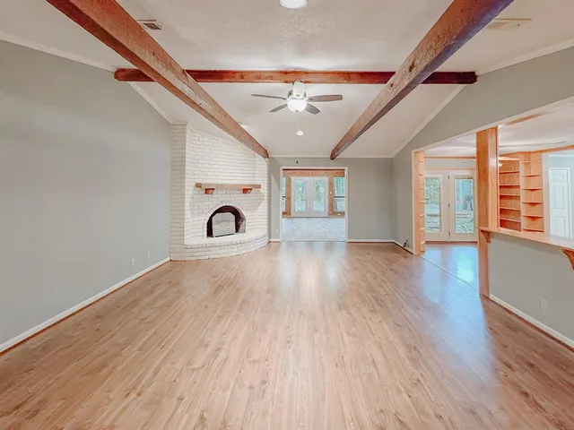 a view of a livingroom with wooden floor