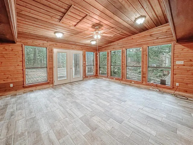 a view of an empty room with a balcony