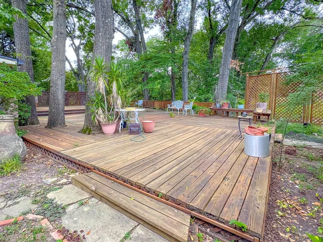 a view of a wooden deck with a patio
