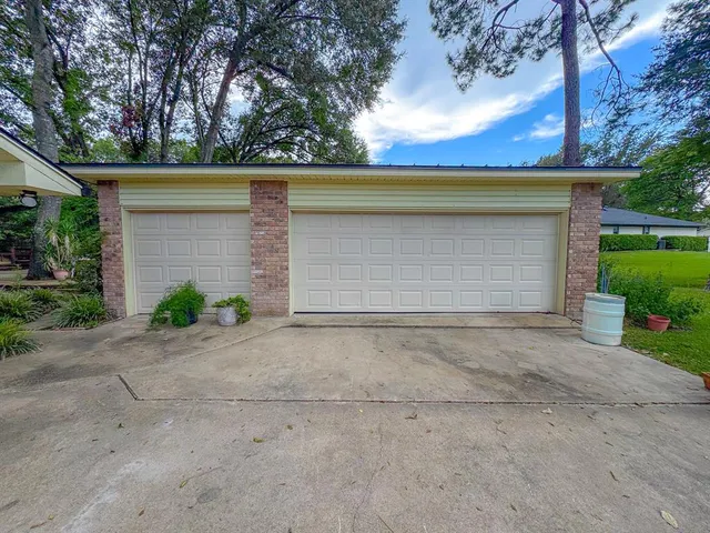 a view of garage and yard