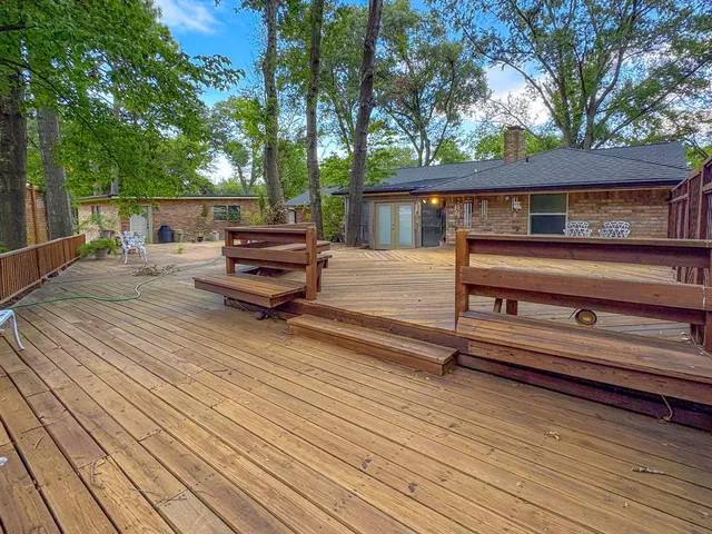 a backyard of a house with barbeque oven and floor