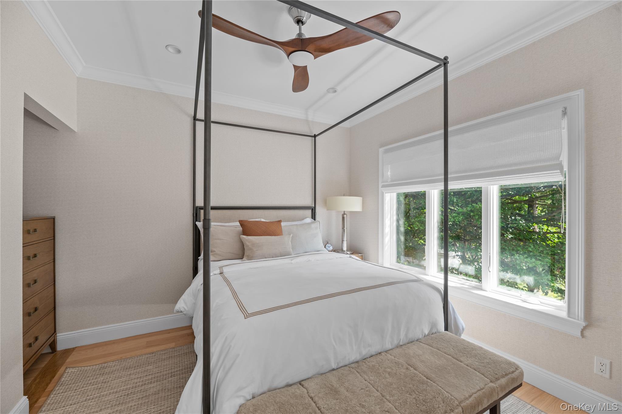 1005 Surf View Ocean Beach, NY 11770 - Photo 16 of 43 a bedroom with a large bed and a window