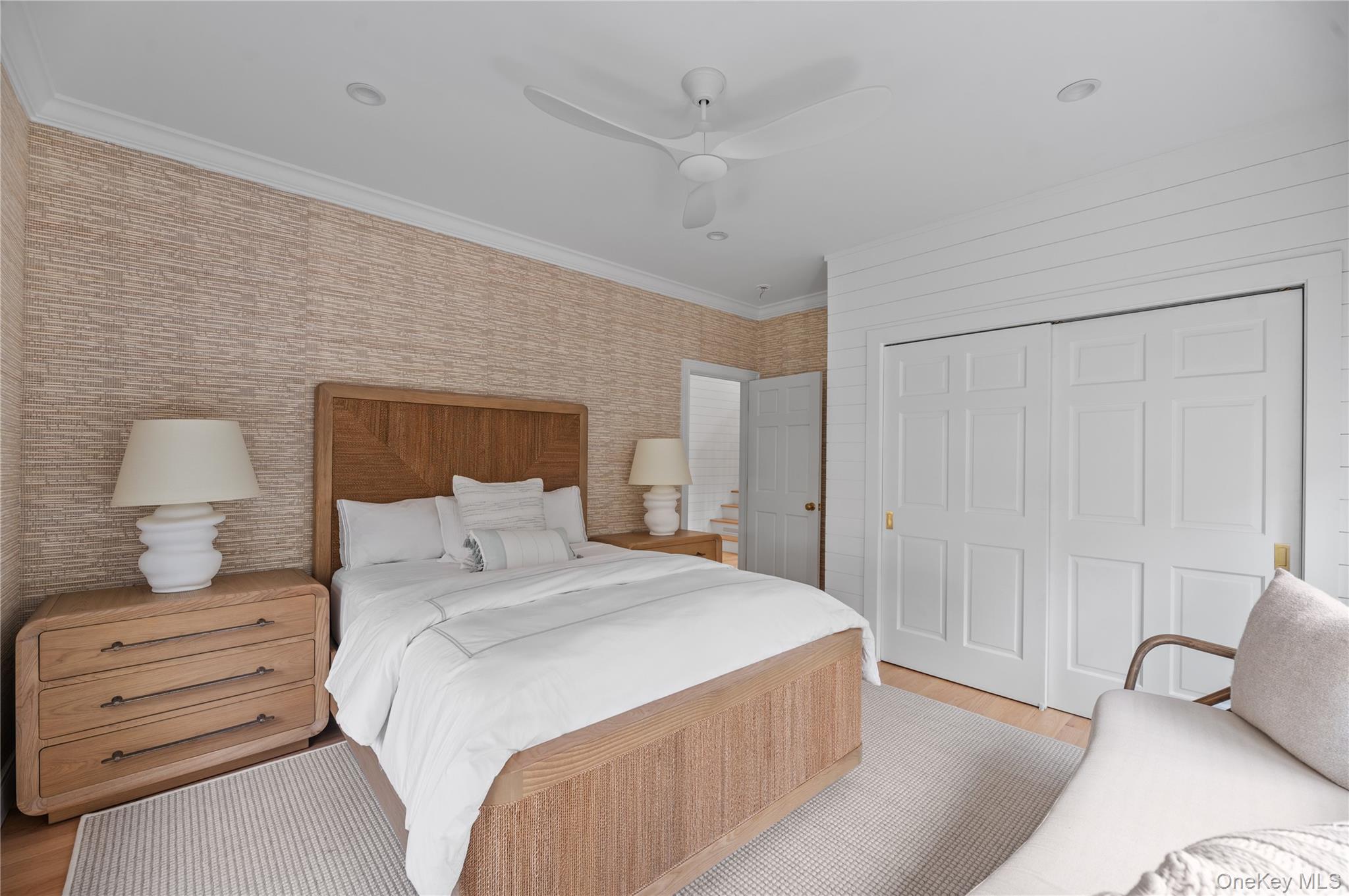 1005 Surf View Ocean Beach, NY 11770 - Photo 21 of 43 a bedroom with a bed and a lamp