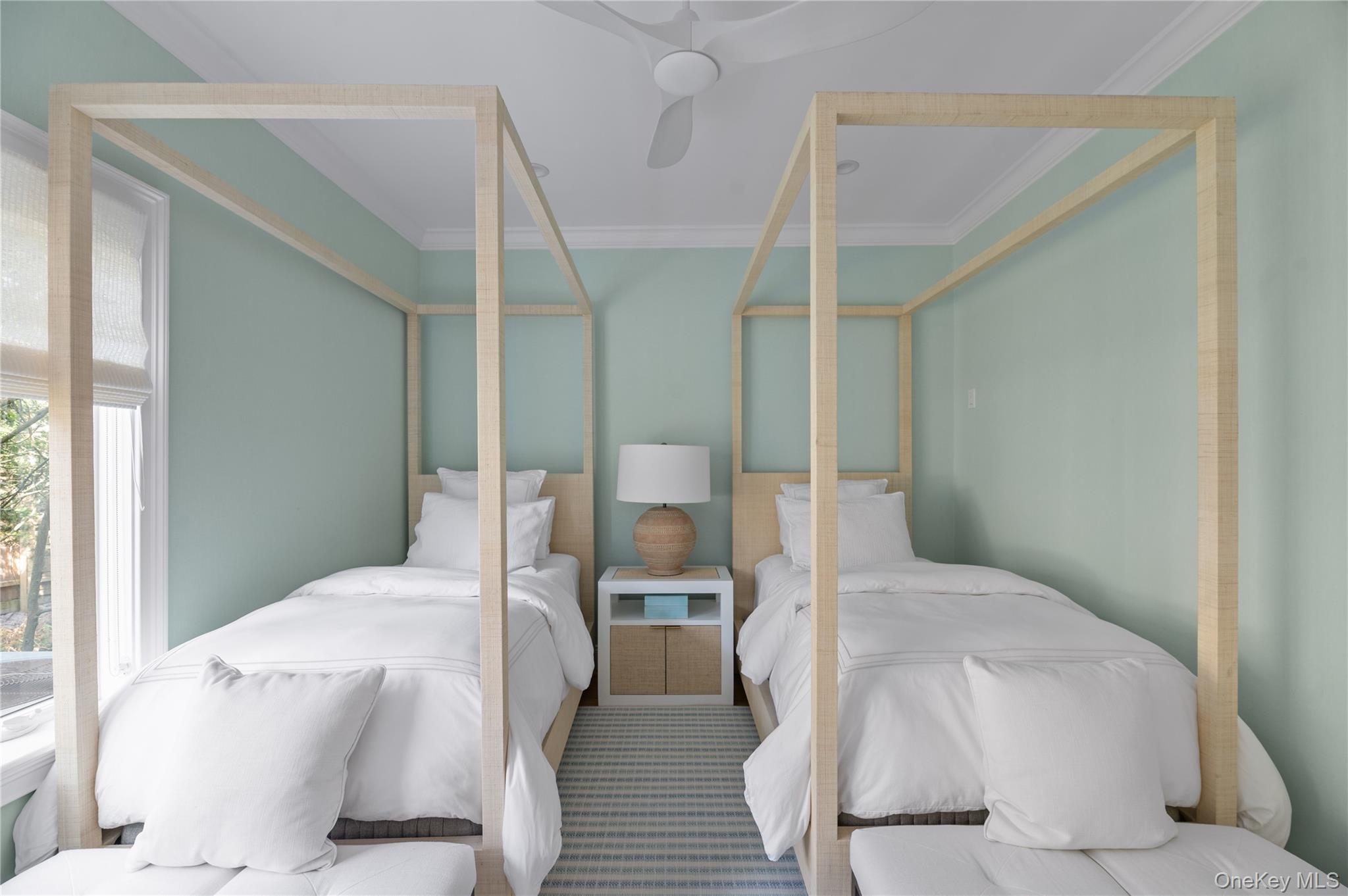 1005 Surf View Ocean Beach, NY 11770 - Photo 24 of 43 a bedroom with a bed and large windows