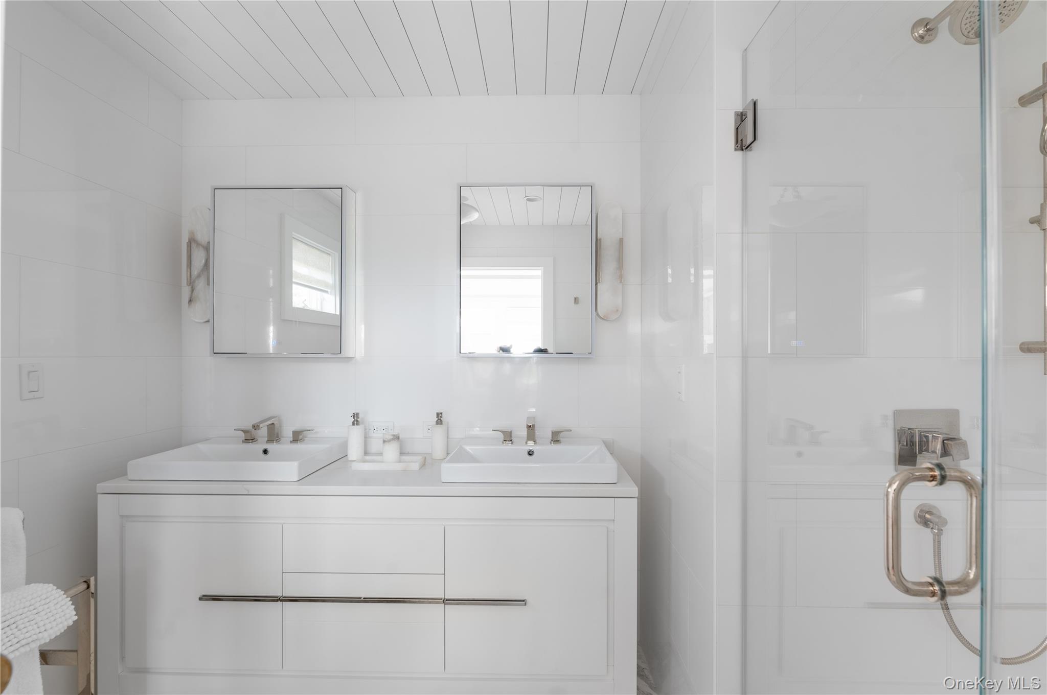 1005 Surf View Ocean Beach, NY 11770 - Photo 26 of 43 a bathroom with a sink vanity and toilet