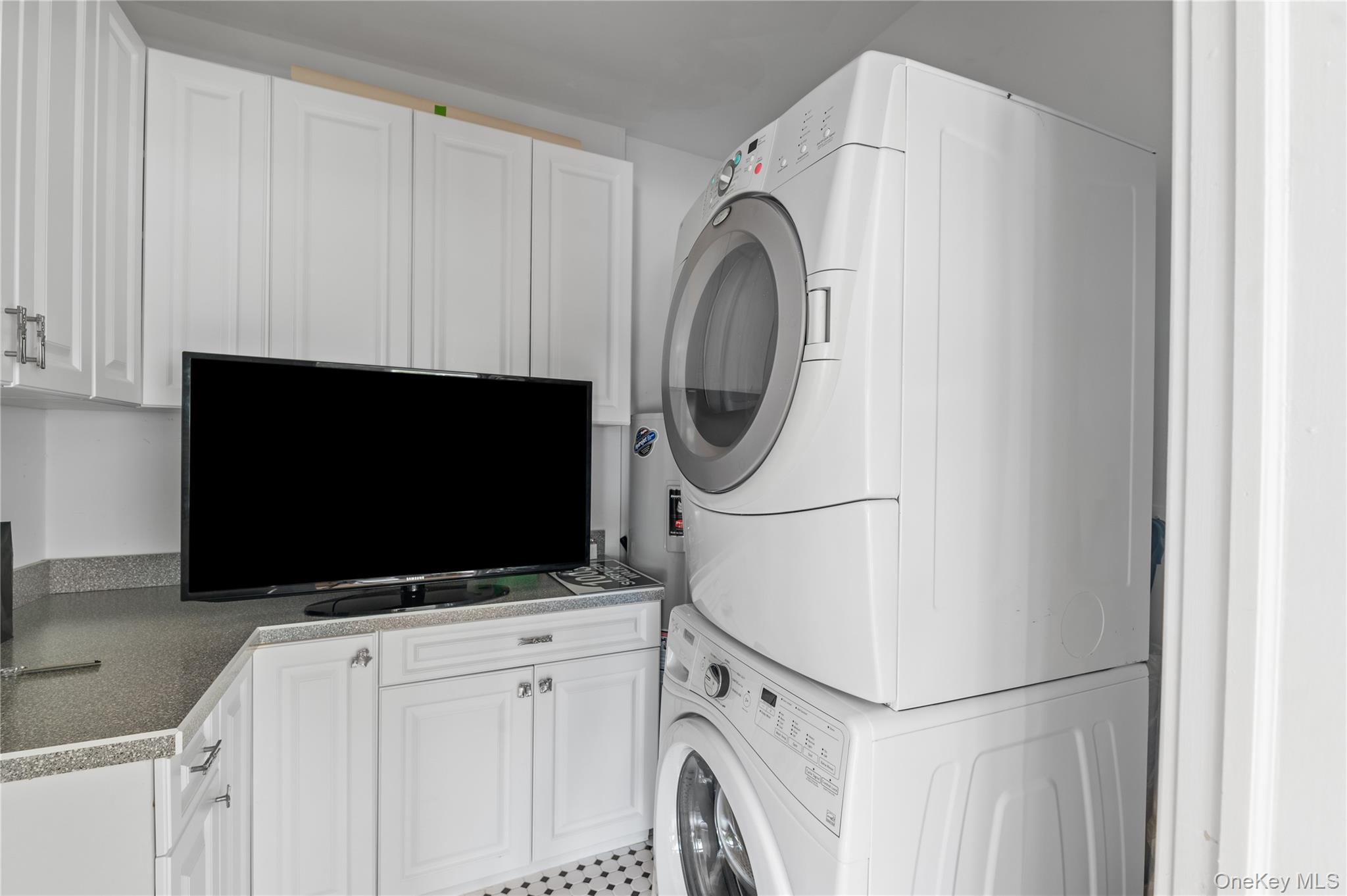 1005 Surf View Ocean Beach, NY 11770 - Photo 32 of 43 a utility room with dryer and washer