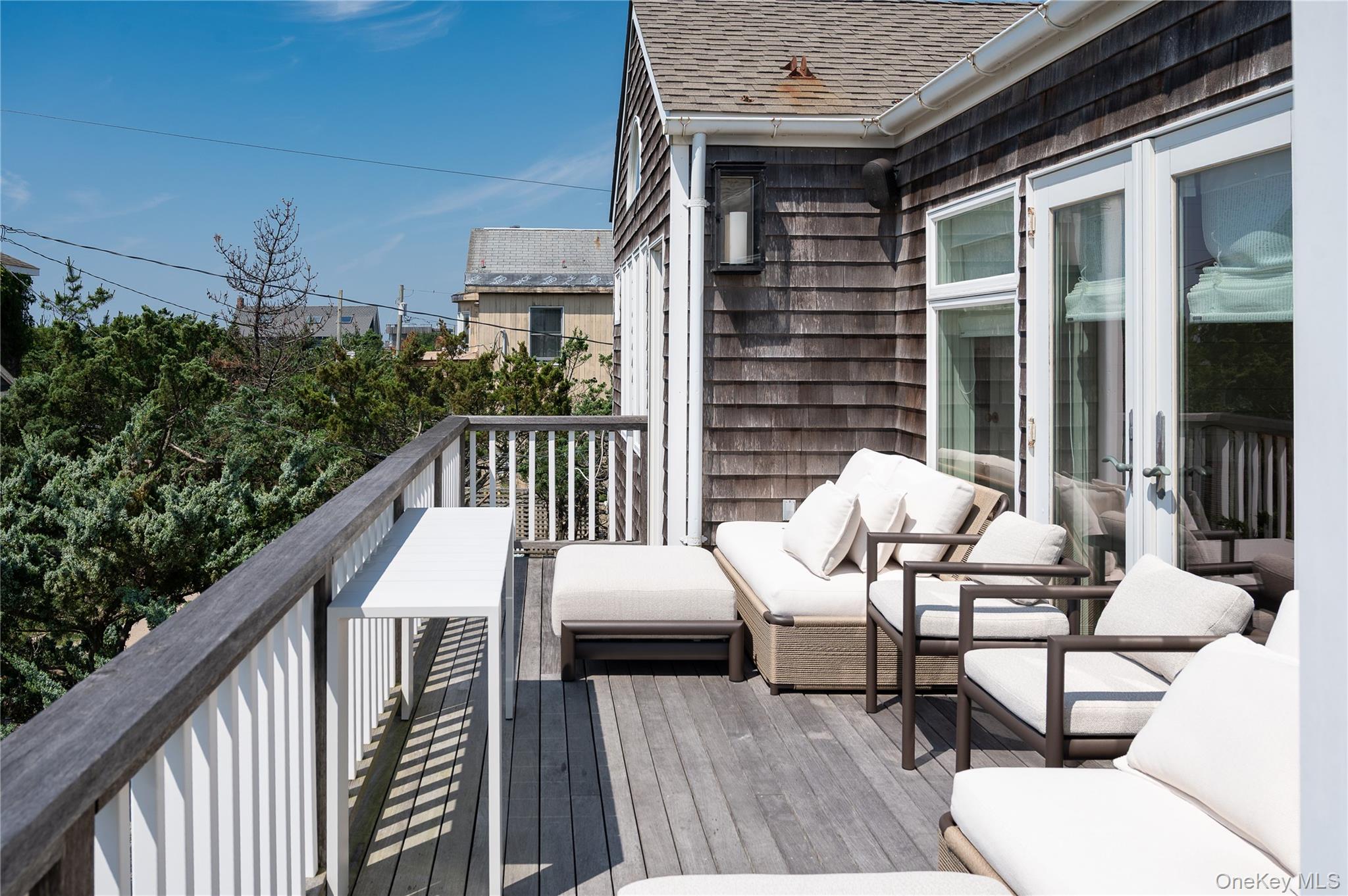 1005 Surf View Ocean Beach, NY 11770 - Photo 33 of 43 a view of balcony with furniture and outdoor space