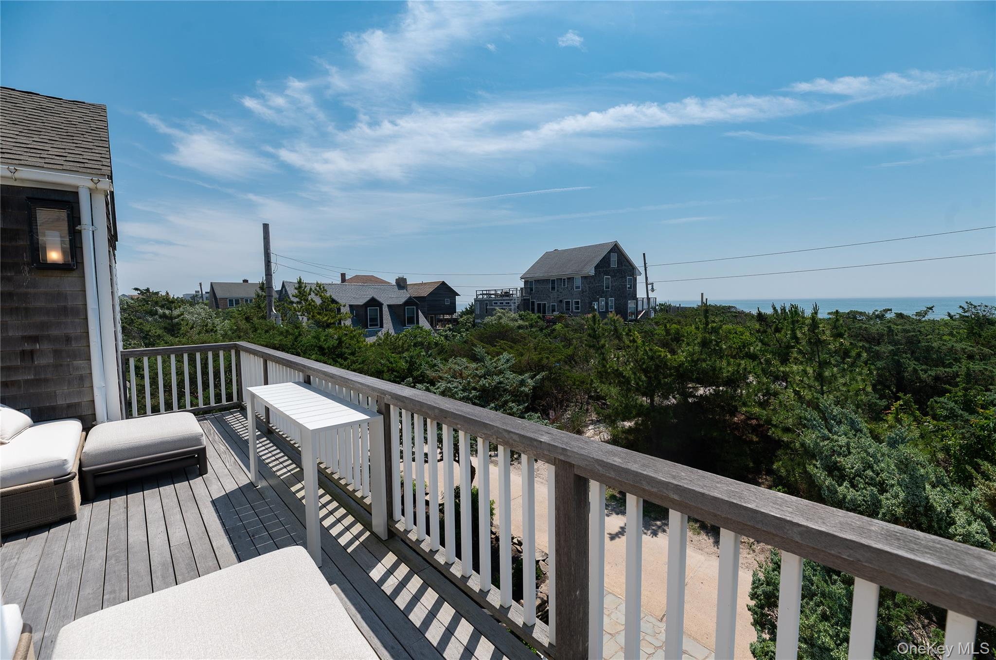 1005 Surf View Ocean Beach, NY 11770 - Photo 35 of 43 a view of balcony with furniture