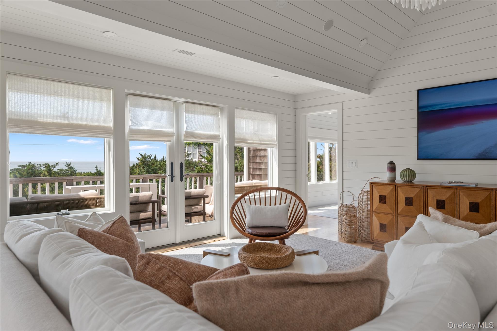 1005 Surf View Ocean Beach, NY 11770 - Photo 9 of 43 a living room with furniture and a large window