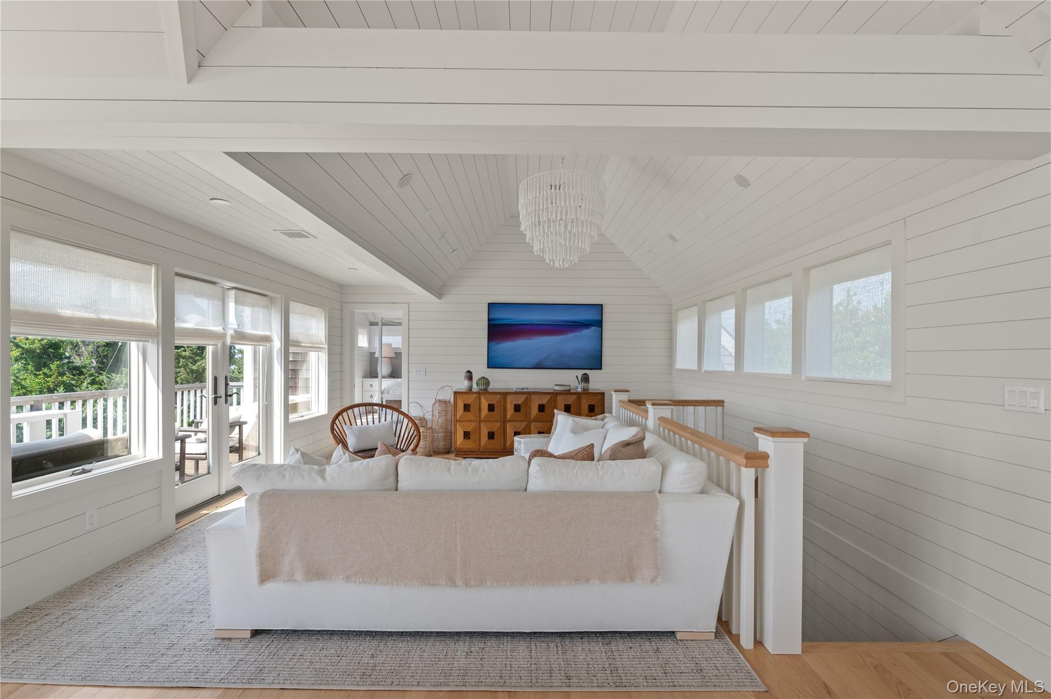 1005 Surf View Ocean Beach, NY 11770 - Photo 10 of 43 a living room with furniture and a window